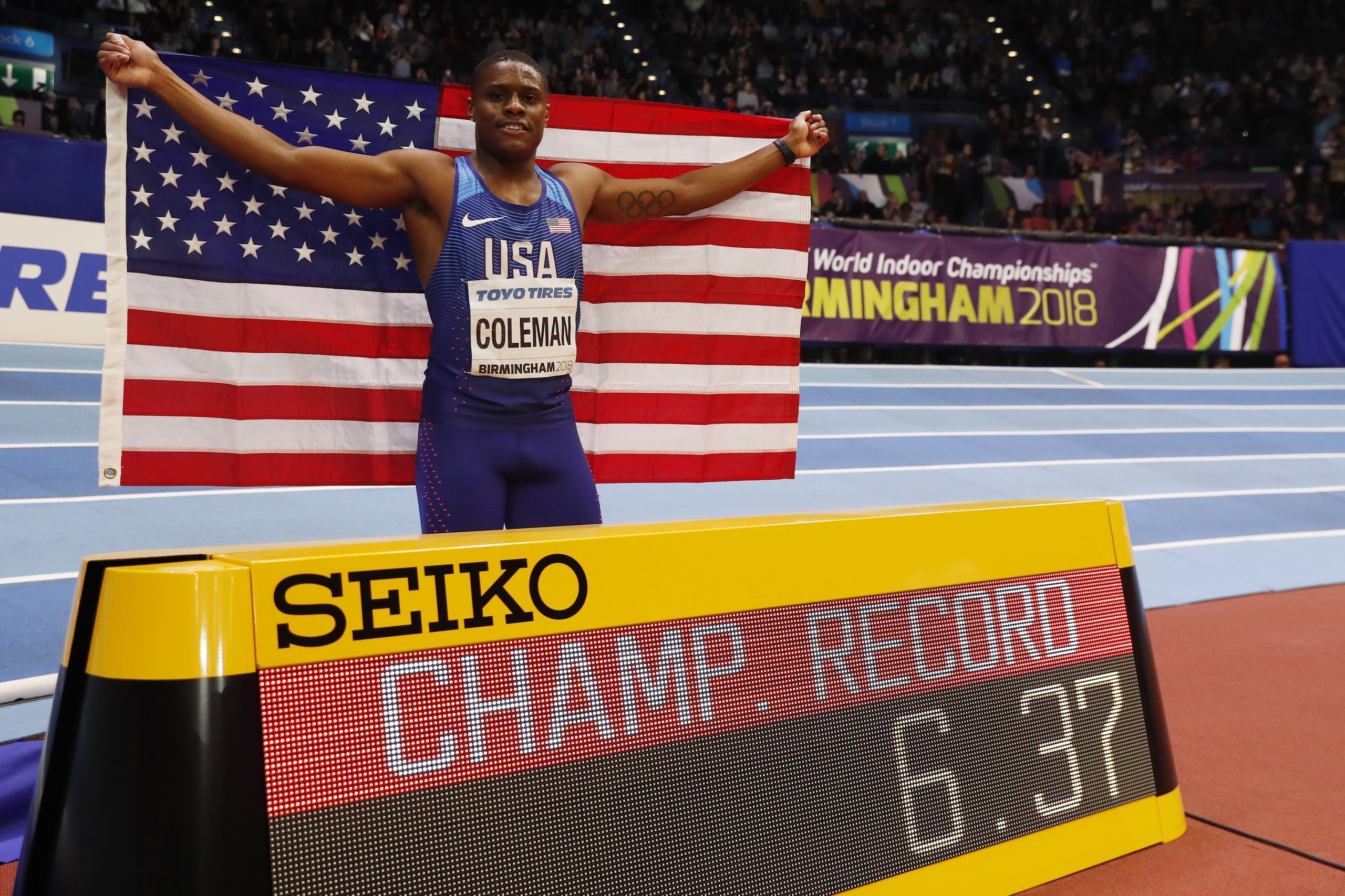 US athlete Christian Coleman celebrates winning the men's 60m final at the 2018 IAAF World Indoor Athletics Championships at the Arena in Birmingham on March 3, 2018. / AFP PHOTO / Adrian DENNIS        (Photo credit should read ADRIAN DENNIS/AFP/Getty Ima