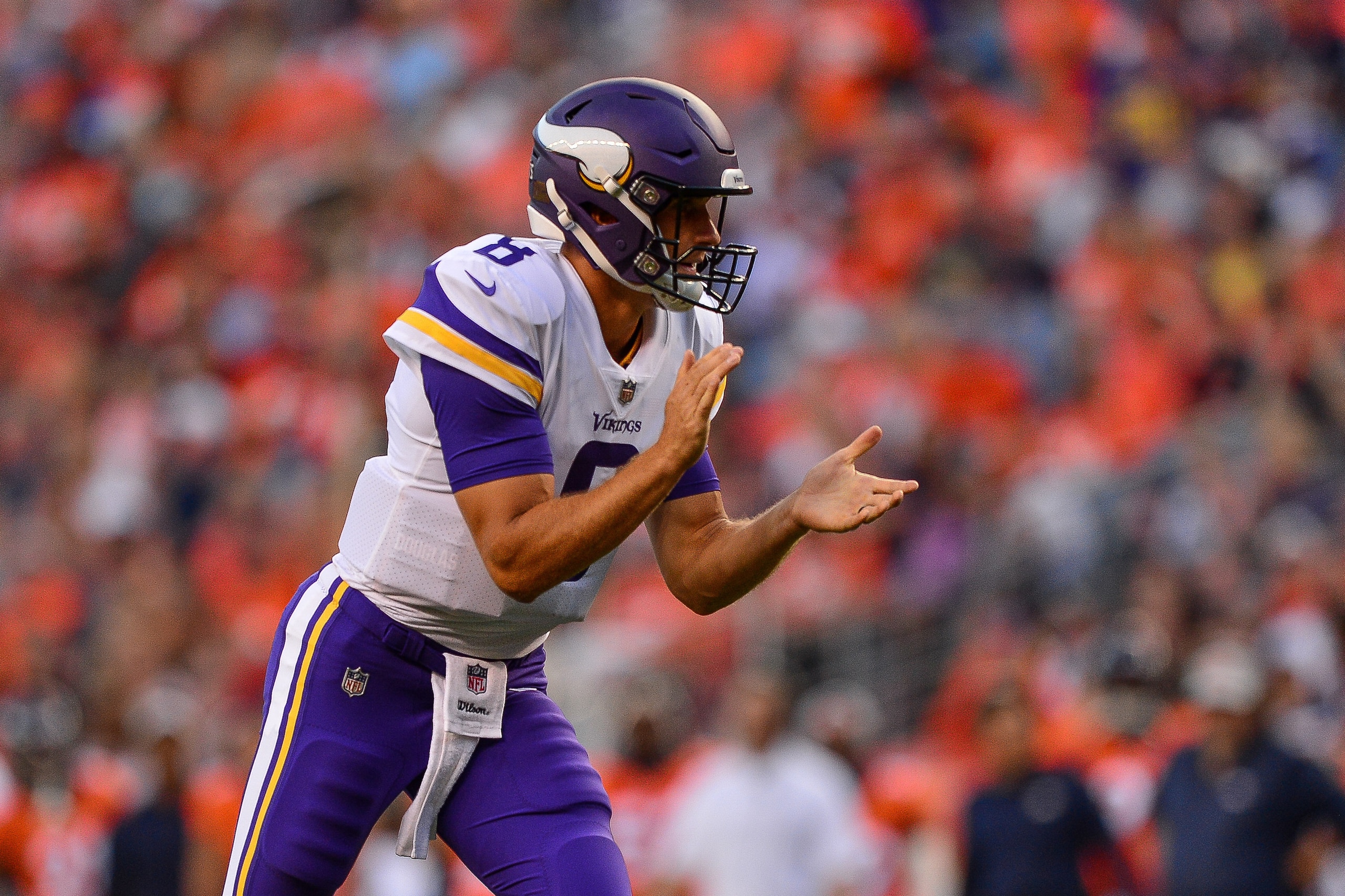 DENVER, CO - AUGUST 11:  Quarterback Kirk Cousins #8 of the Minnesota Vikings celebrates after a touchdown pass to wide receiver Stefon Diggs #14 in the first quarter of a game against the Denver Broncos during an NFL preseason game at Broncos Stadium at 