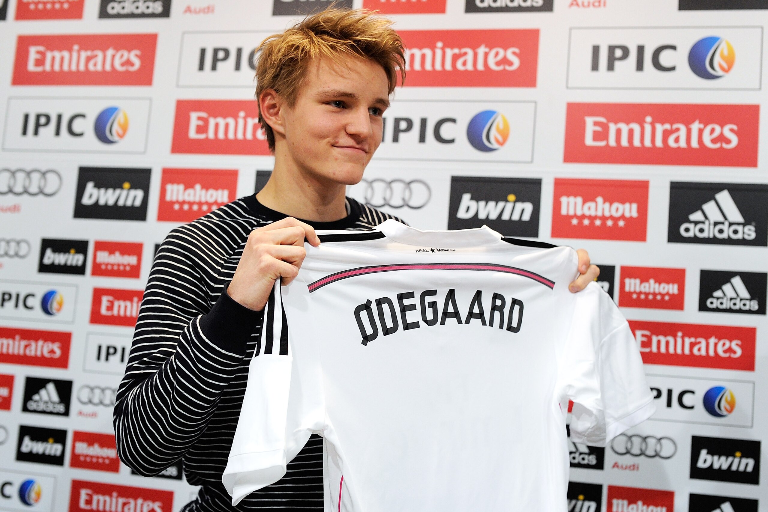 MADRID, SPAIN - JANUARY 22:  Martin Odegaard from Norway holds his new Real Madrid shirt during a press conference at Real Madrid's Valdebebas training grounds after he signed with Real on January 22, 2015 in Madrid, Spain. Odegaard aged 16 will play for 