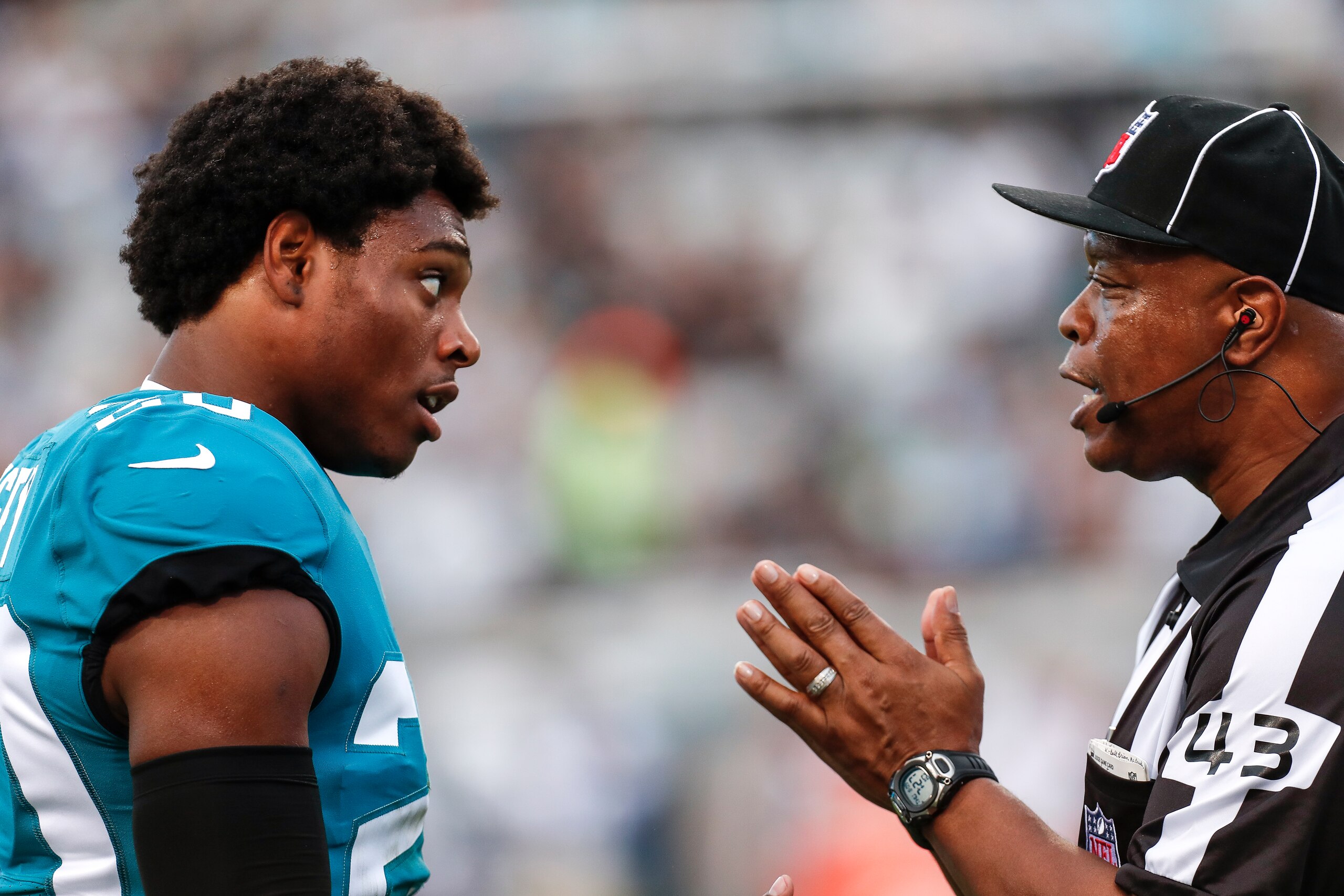 JACKSONVILLE, FL - AUGUST 9: Cornerback Jalen Ramsey #20 of the Jacksonville Jaguars talks with Field Judge Terry Brown about a play during a preseason game against the New Orleans Saints at TIAA Bank Field on August 9, 2018 in Jacksonville, Florida. The 