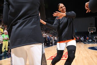 MINNEAPOLIS, MN - JULY 28:  Liz Cambage #8 of Team Parker high-fives teammates before the Verizon WNBA All-Star Game 2018 on July 28, 2018 at the Target Center in Minneapolis, Minnesota. NOTE TO USER: User expressly acknowledges and agrees that, by downlo