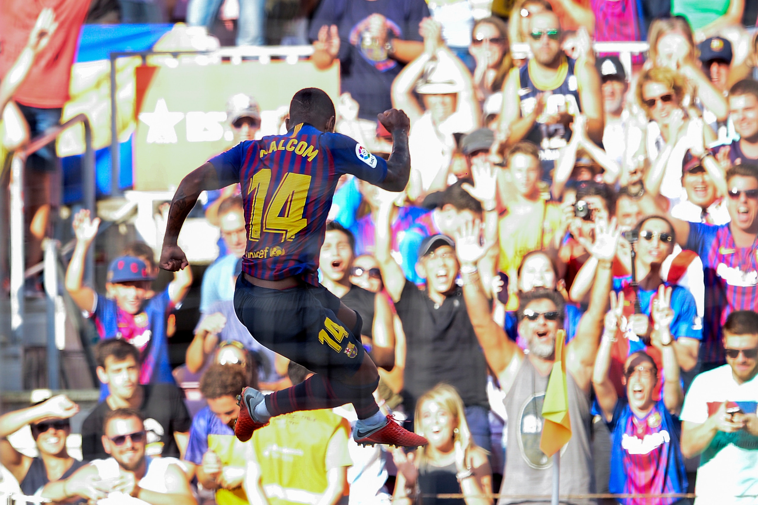 Barcelona's Brazilian midfielder Malcom celebrates after scoring a goal during the 53rd Joan Gamper Trophy friendly football match between Barcelona and Boca Juniors at the Camp Nou stadium in Barcelona on August 15, 2018. (Photo by Josep LAGO / AFP)     