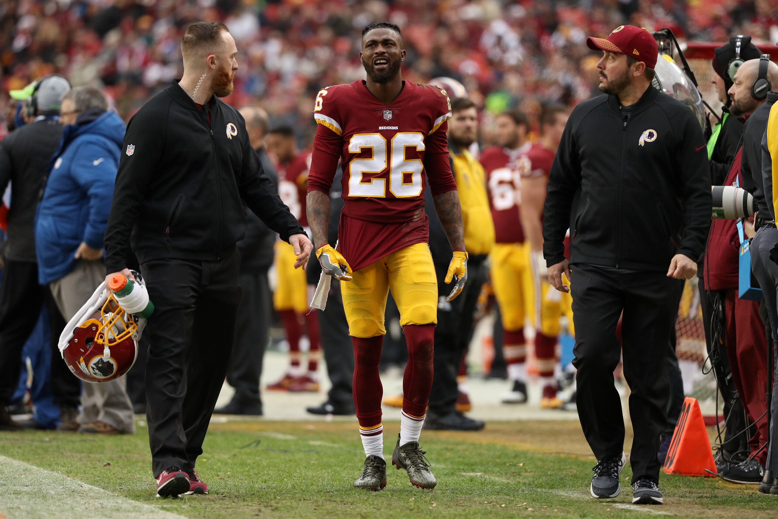 LANDOVER, MD - DECEMBER 17: Cornerback Bashaud Breeland #26 of the Washington Redskins walks off the field after being injured in the fourth quarter against the Arizona Cardinals at FedEx Field on December 17, 2017 in Landover, Maryland. (Photo by Patrick