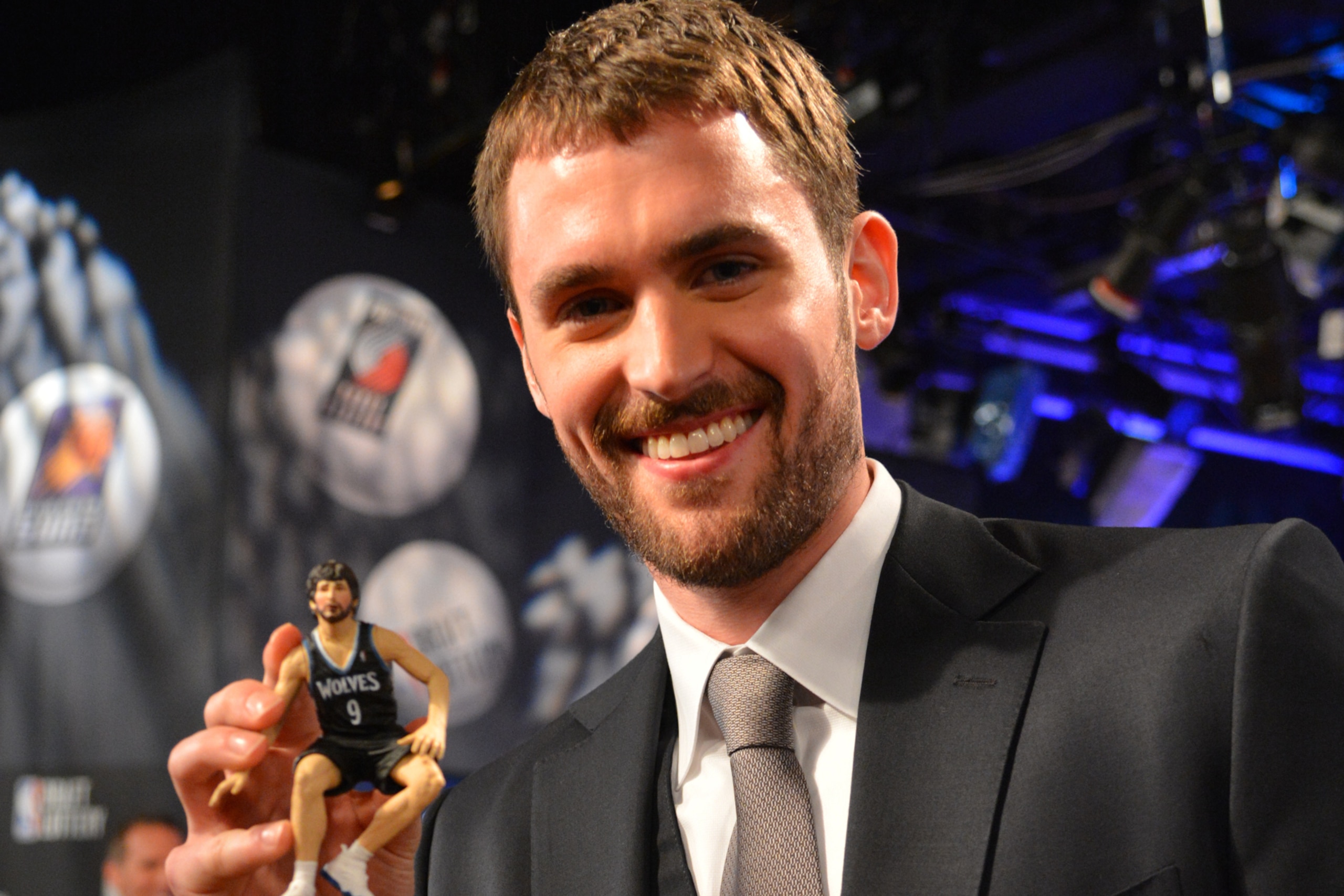 NEW YORK, NY - MAY 21: Kevin Love of the Minnesota Timberwolves poses with his good luck charm, a Ricky Rubio figurine at the 2013 NBA Draft Lottery on May 21, 2013 at the ABC News' 'Good Morning America' Times Square Studio in New York City. NOTE TO USER