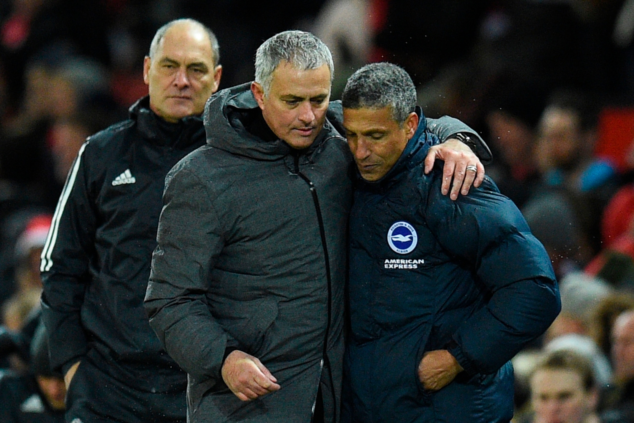 Manchester United's Portuguese manager Jose Mourinho (2R) leaves the pitch with Brighton's Irish manager Chris Hughton (R) during the English Premier League football match between Manchester United and Brighton and Hove Albion at Old Trafford in Mancheste Manchester United's Portuguese manager Jose Mourinho (2R) leaves the pitch with Brighton's Irish manager Chris Hughton (R) during the English Premier League football match between Manchester United and Brighton and Hove Albion at Old Trafford in Mancheste