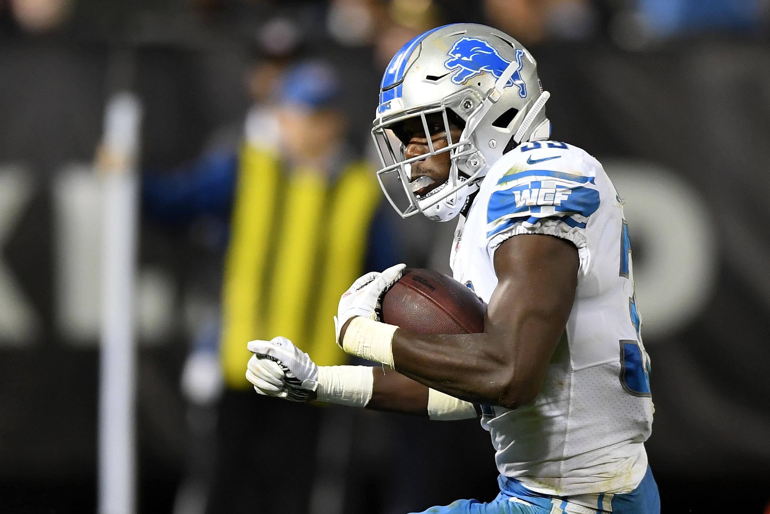 OAKLAND, CA - AUGUST 10:  Kerryon Johnson #33 of the Detroit Lions carries the ball against the Oakland Raiders during the third quarter of an NFL preseason football game at Oakland Alameda Coliseum on August 10, 2018 in Oakland, California.  (Photo by Th