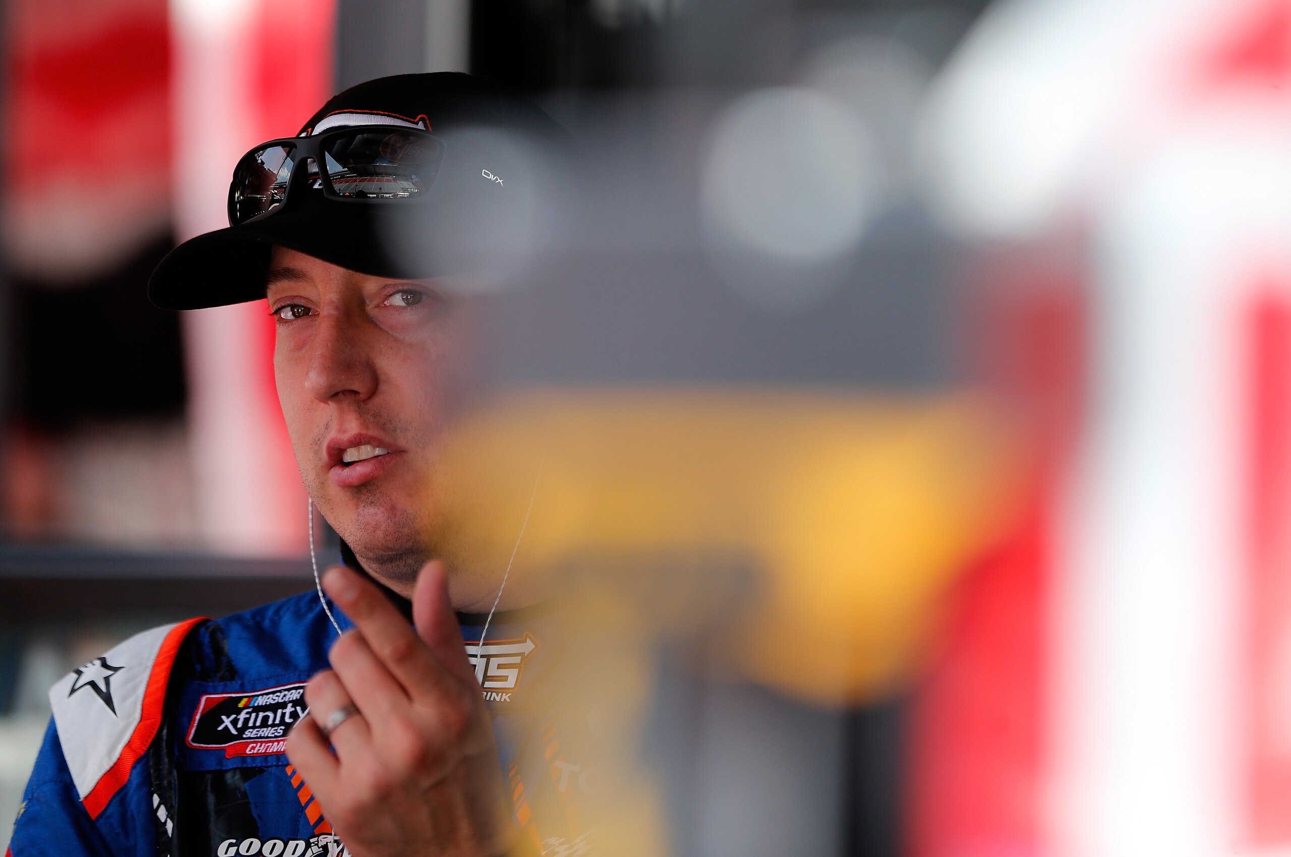 BRISTOL, TN - AUGUST 16:  Kyle Busch, driver of the #18 NOS Energy Drink Toyota, stands in the garage area during practice for the NASCAR Xfinity Series Food City 300 at Bristol Motor Speedway on August 16, 2018 in Bristol, Tennessee.  (Photo by Brian Law