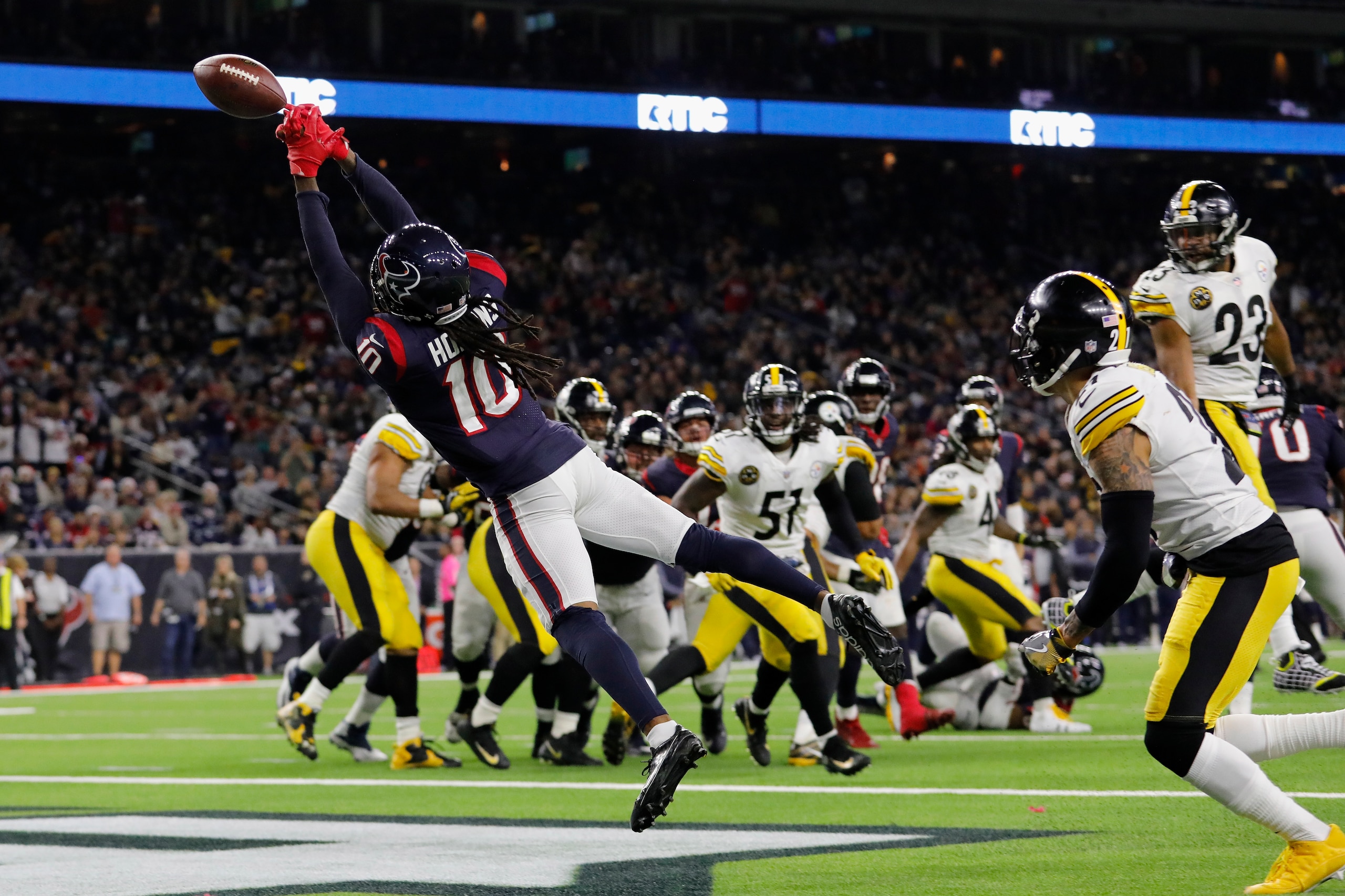 HOUSTON, TX - DECEMBER 25:  DeAndre Hopkins #10 of the Houston Texans reaches for a pass on a two point conversion attempt defended by Joe Haden #21 of the Pittsburgh Steelers in the fourth quarter at NRG Stadium on December 25, 2017 in Houston, Texas.  (