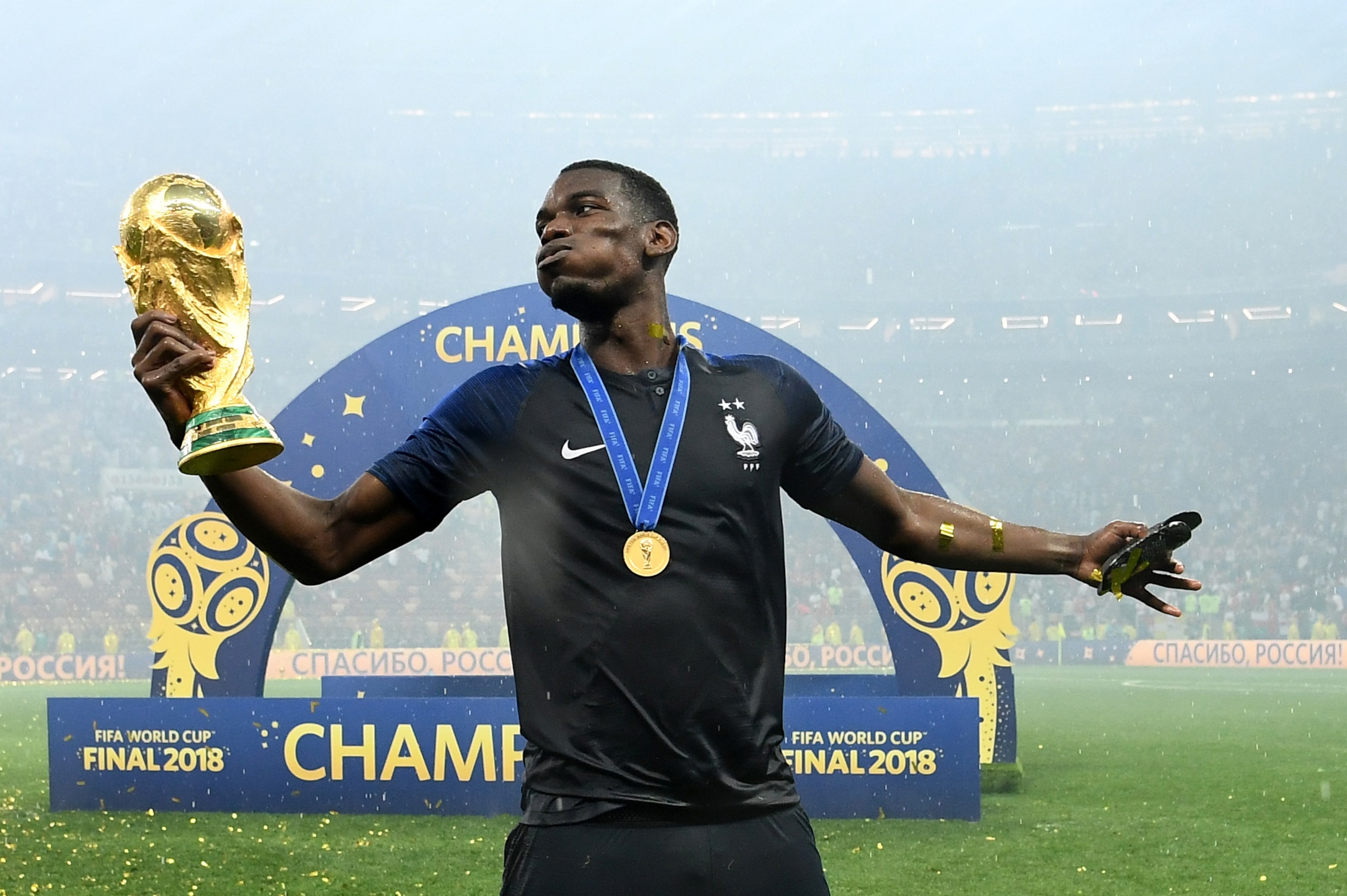 France's midfielder Paul Pogba celebrates with the World Cup trophy after the Russia 2018 World Cup final football match between France and Croatia at the Luzhniki Stadium in Moscow on July 15, 2018. (Photo by FRANCK FIFE / AFP) / RESTRICTED TO EDITORIAL 