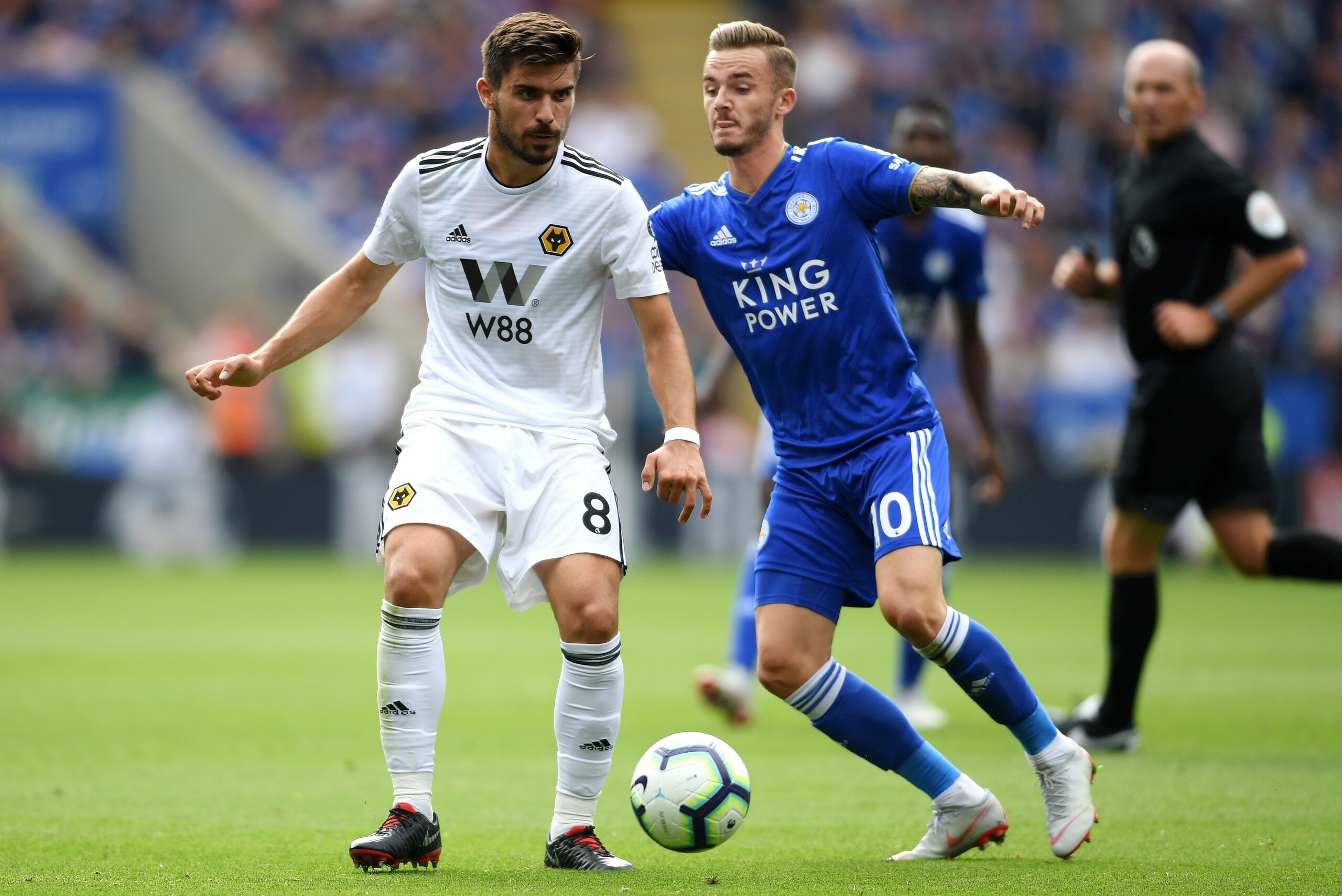 LEICESTER, ENGLAND - AUGUST 18:  Ruben Neves of Wolverhampton Wanderers and James Maddison of Leicester City battle for the ball during the Premier League match between Leicester City and Wolverhampton Wanderers at The King Power Stadium on August 18, 201