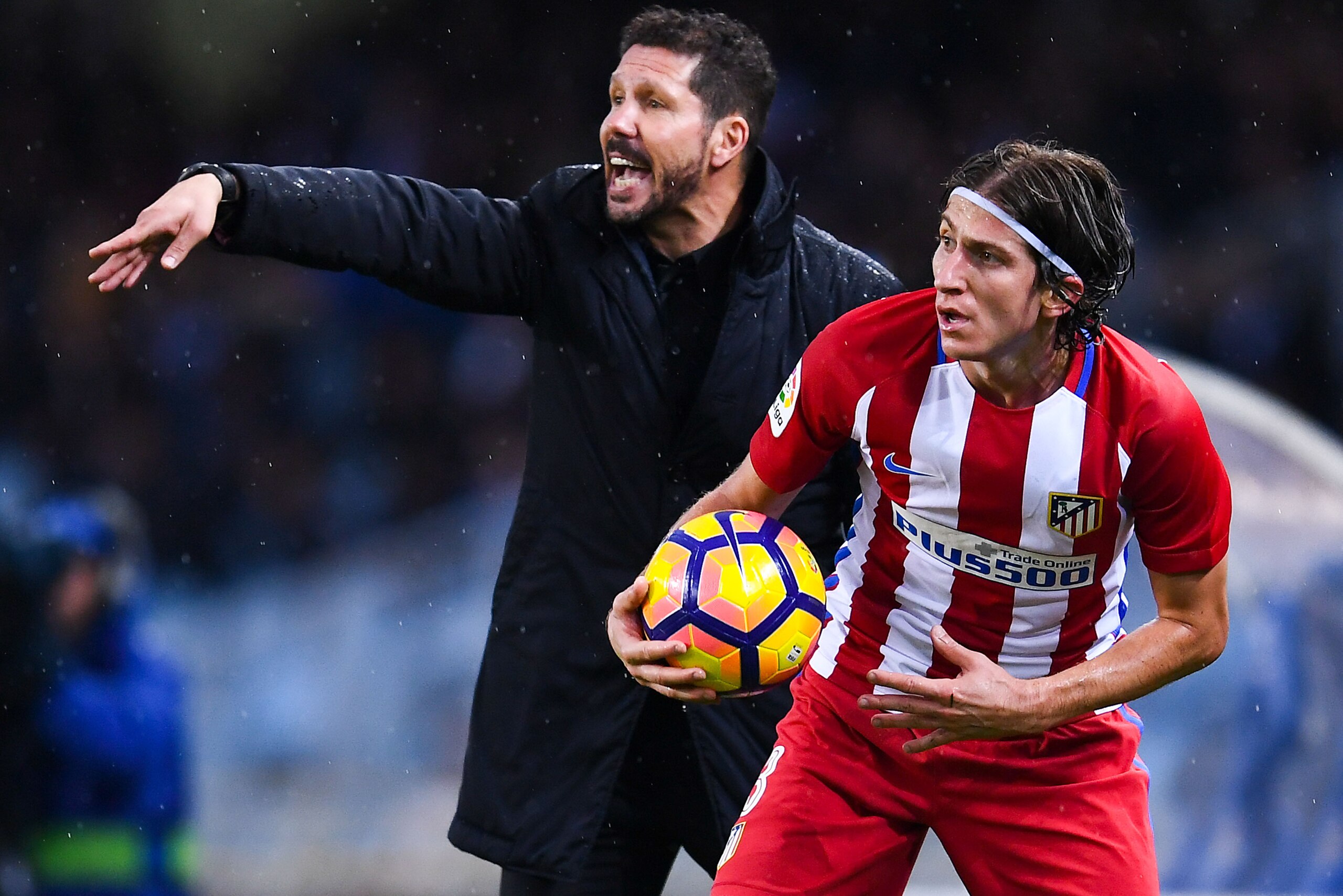 SAN SEBASTIAN, SPAIN - NOVEMBER 05:  Head coach Diego Pablo Simeone of Atletico Madrid reacts next to Filipe Luis of Club Atletico de Madrid reacts during the La Liga match between Real Sociedad de Futbol and Atletico de Madrid at Anoeta stadium on Novemb