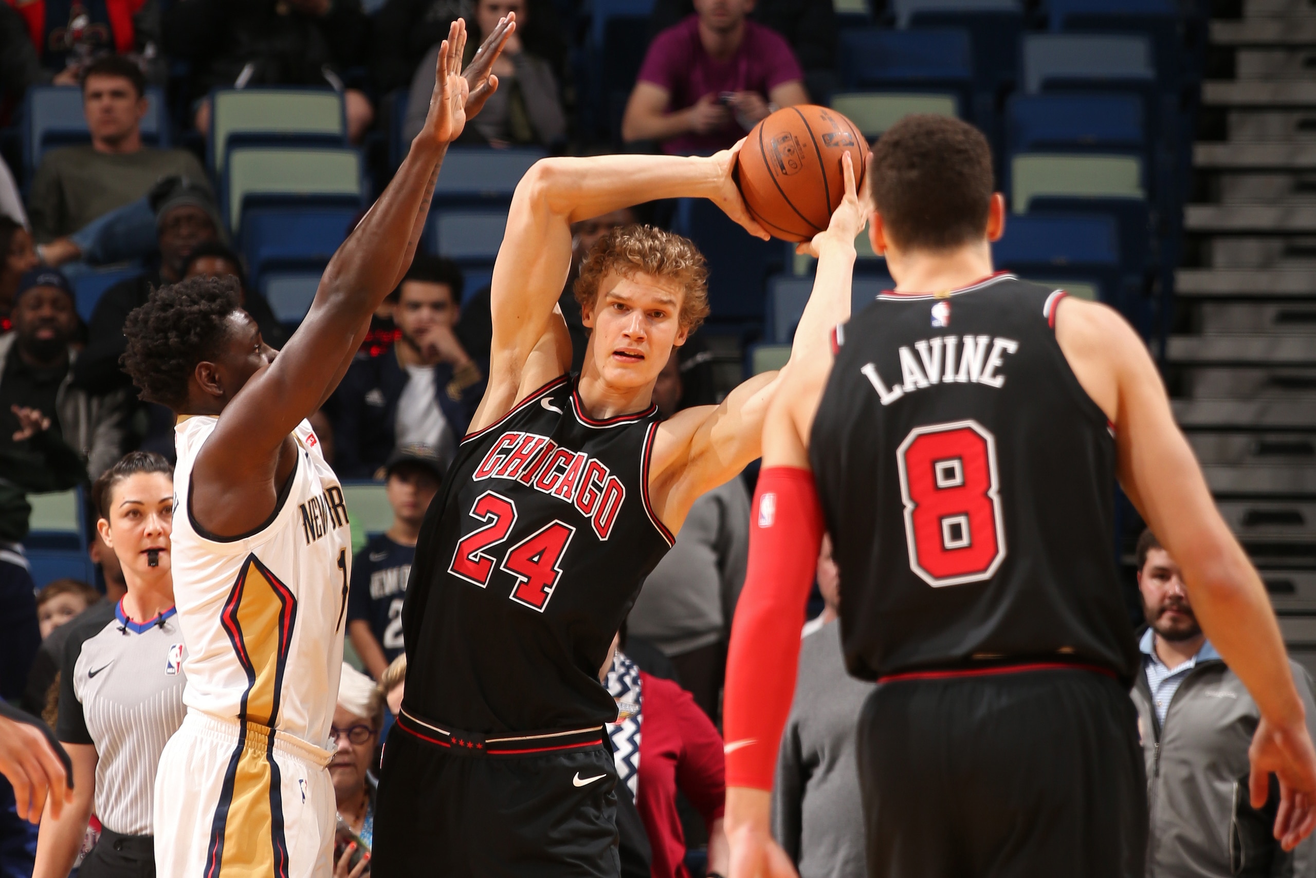 NEW ORLEANS, LA - JANUARY 22: Lauri Markkanen #24 passes the ball to Zach LaVine #8 of the Chicago Bulls during the game against the New Orleans Pelicans on January 22, 2018 at the Smoothie King Center in New Orleans, Louisiana. NOTE TO USER: User express
