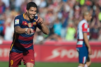 Barcelona's Uruguayan forward Luis Suarez celebrates after scoring his third goal during the Spanish league football match Granada CF vs FC Barcelona at Nuevo Los Carmenes stadium in Granada on May 14, 2016. / AFP / JORGE GUERRERO        (Photo credit sho