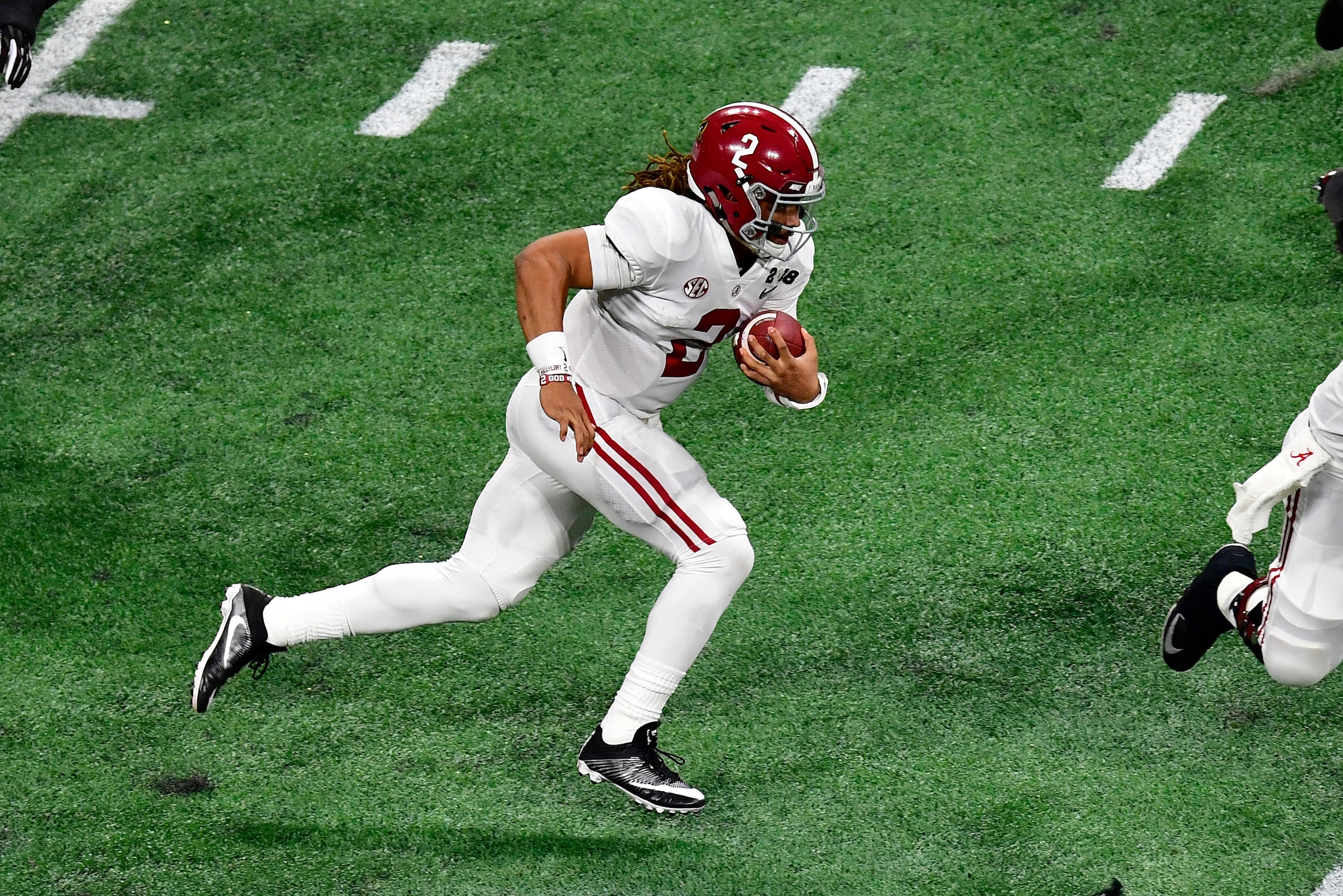 ATLANTA, GA - JANUARY 08: Jalen Hurts #2 of the Alabama Crimson Tide scrambles against the Georgia Bulldogs in the CFP National Championship presented by AT&T at Mercedes-Benz Stadium on January 8, 2018 in Atlanta, Georgia. (Photo by Scott Cunningham/Gett
