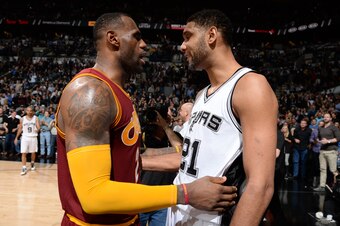 SAN ANTONIO, TX - JANUARY 14:  LeBron James #23 of the Cleveland Cavaliers and Tim Duncan #21 of the San Antonio Spurs after the game on January 14, 2016 at the AT&T Center in San Antonio, Texas. NOTE TO USER: User expressly acknowledges and agrees that, 