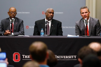 Meyer (right) along with OSU President Michael Drake (left) and athletic director Gene Smith