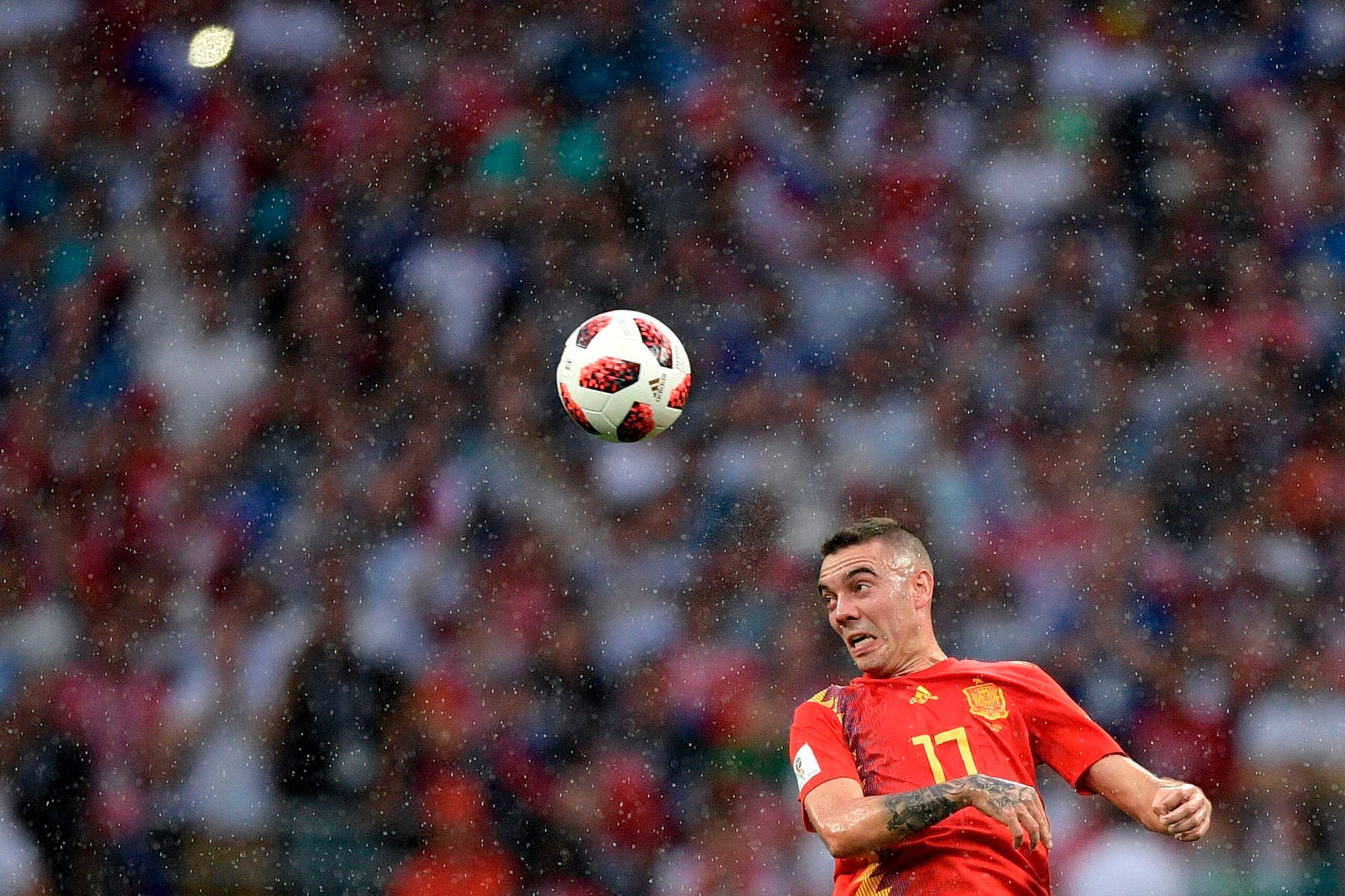 TOPSHOT - Spain's forward Iago Aspas heads the ball during the Russia 2018 World Cup round of 16 football match between Spain and Russia at the Luzhniki Stadium in Moscow on July 1, 2018. (Photo by Juan Mabromata / AFP) / RESTRICTED TO EDITORIAL USE - NO 