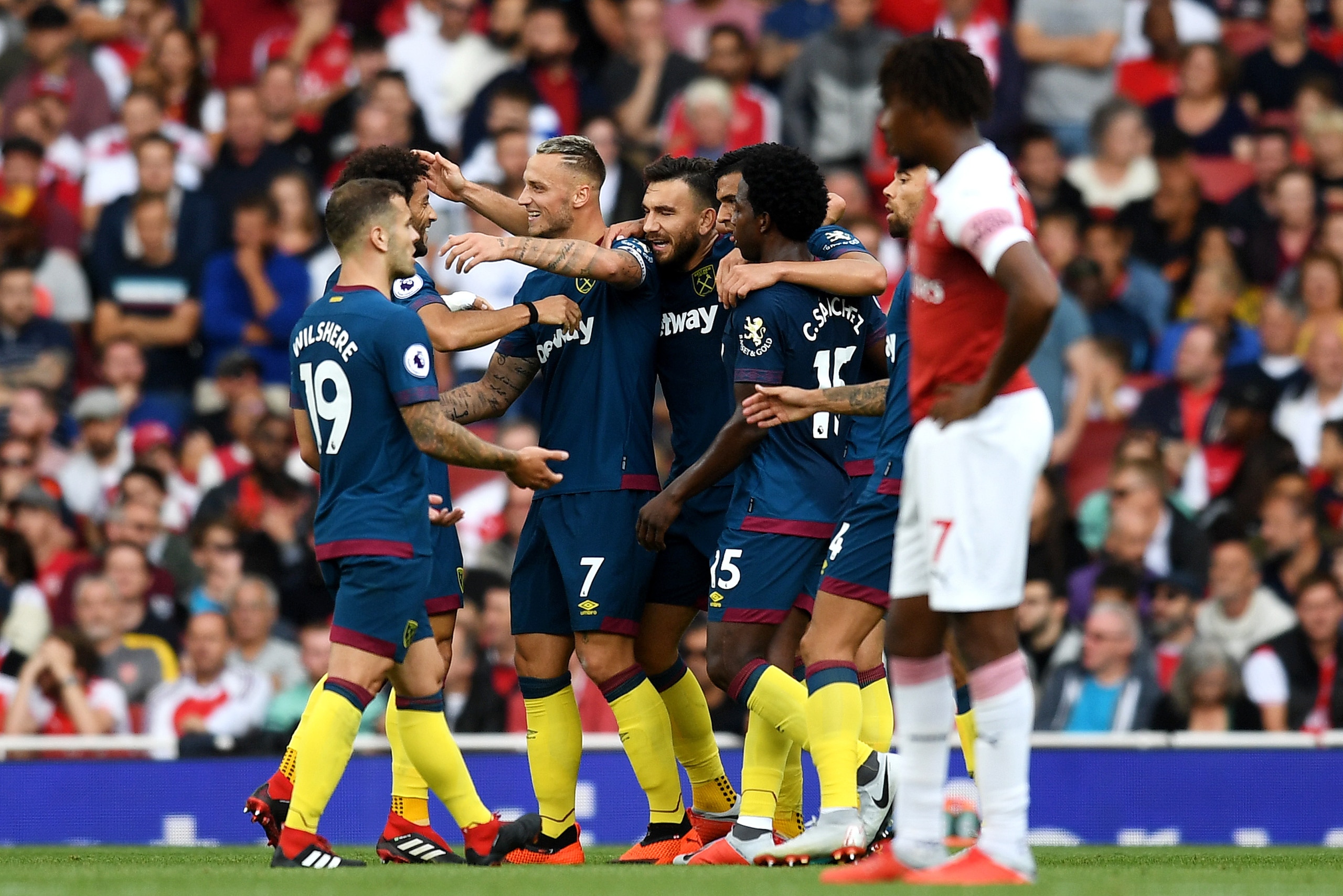 LONDON, ENGLAND - AUGUST 25:  Marko Arnautovic of West Ham United celebrates with teammates after he scores his sides first goal during the Premier League match between Arsenal FC and West Ham United at Emirates Stadium on August 25, 2018 in London, Unite