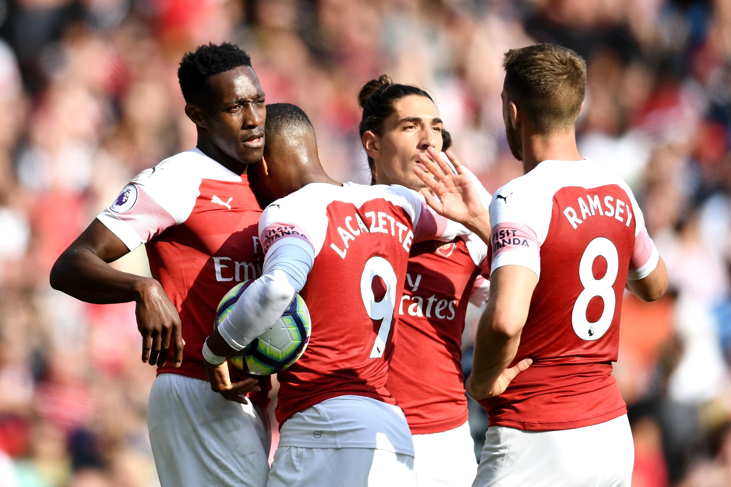 LONDON, ENGLAND - AUGUST 25:  Danny Welbeck of Arsenal celebrates with teammates after he scores his sides third goal during the Premier League match between Arsenal FC and West Ham United at Emirates Stadium on August 25, 2018 in London, United Kingdom. 