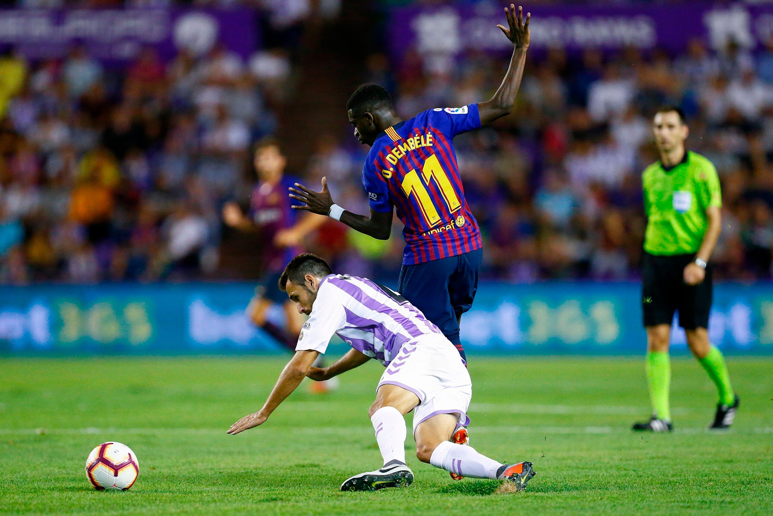 Barcelona's French forward Ousmane Dembele vies with Real Valladolid's Spanish defender Kiko Olivas during the Spanish league football match between Real Valladolid and FC Barcelona at the Jose Zorrilla Stadium in Valladolid on August 25, 2018. (Photo by 