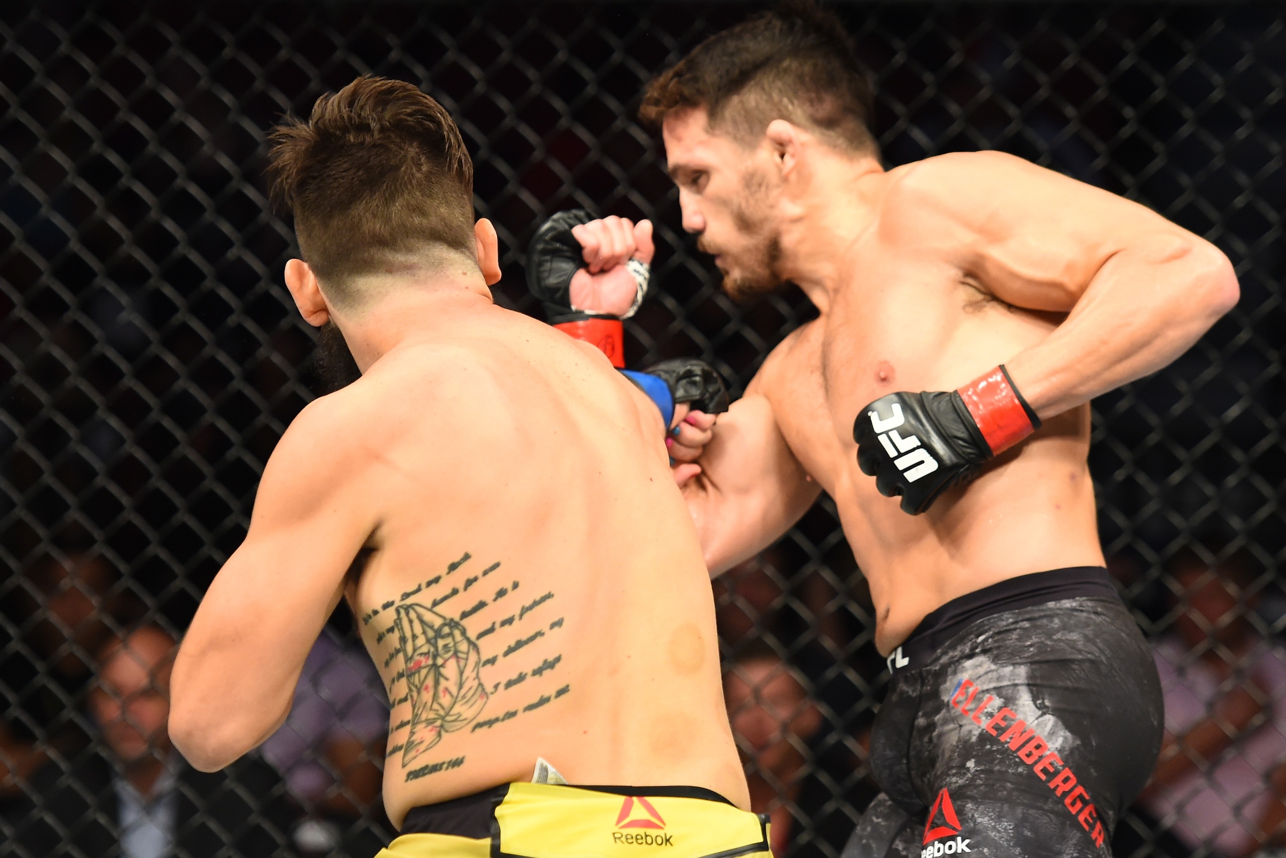 LINCOLN, NE - AUGUST 25:  (L-R) Bryan Barberena punches Jake Ellenberger in their welterweight fight during the UFC Fight Night event at Pinnacle Bank Arena on August 25, 2018 in Lincoln, Nebraska. (Photo by Josh Hedges/Zuffa LLC/Zuffa LLC via Getty Image