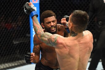 LINCOLN, NE - AUGUST 25:  (L-R) Michael Johnson punches Andre Fili in their lightweight fight during the UFC Fight Night event at Pinnacle Bank Arena on August 25, 2018 in Lincoln, Nebraska. (Photo by Josh Hedges/Zuffa LLC/Zuffa LLC via Getty Images)