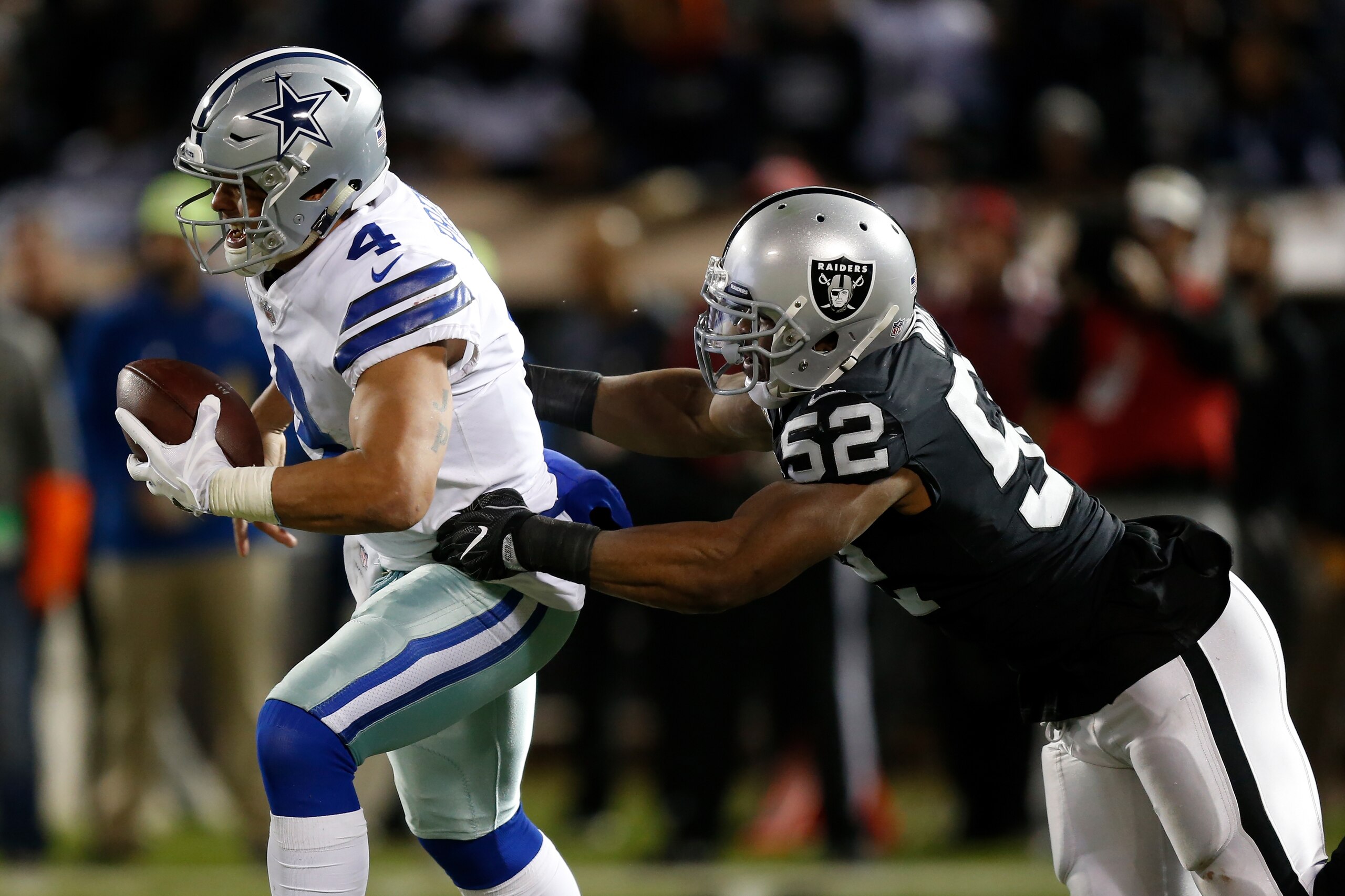 OAKLAND, CA - DECEMBER 17:  Khalil Mack #52 of the Oakland Raiders sacks Dak Prescott #4 of the Dallas Cowboys during their NFL game at Oakland-Alameda County Coliseum on December 17, 2017 in Oakland, California.  (Photo by Lachlan Cunningham/Getty Images