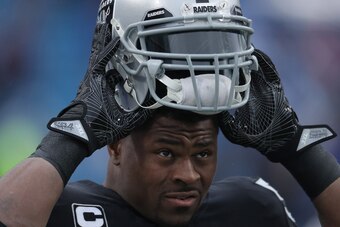 BUFFALO, NY - OCTOBER 29: Khalil Mack #52 of the Oakland Raiders puts on his helmet as he warms up before the start of NFL game action against the Buffalo Bills at New Era Field on October 29, 2017 in Buffalo, New York. (Photo by Tom Szczerbowski/Getty Im