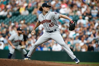 SEATTLE, WA - JULY 30: Gerrit Cole #45 of the Houston Astros delivers against the Seattle Mariners in the first inning  at Safeco Field on July 30, 2018 in Seattle, Washington. (Photo by Lindsey Wasson/Getty Images)
