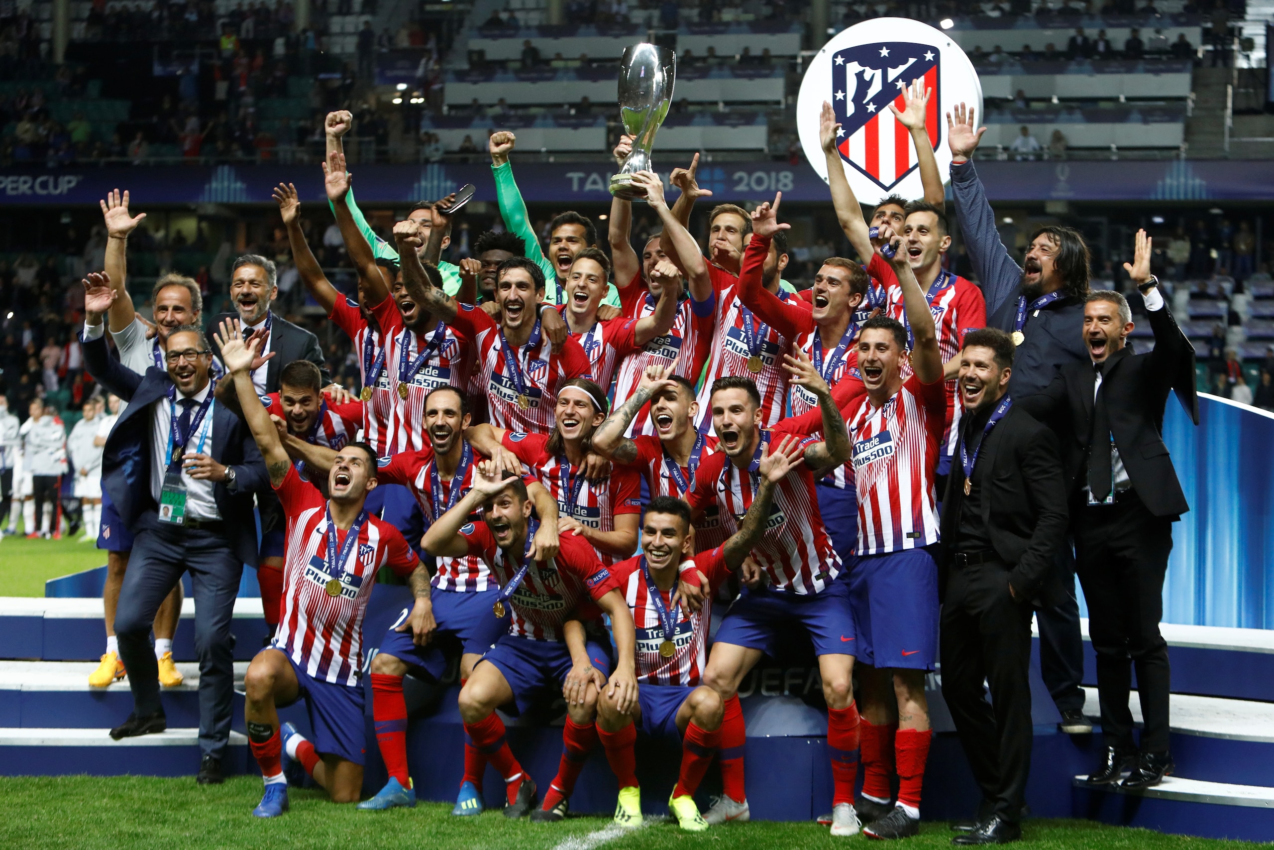 TALLINN, ESTONIA - AUGUST 15: Atletico Madrid players celebrate with the trophy after the UEFA Super Cup match between Real Madrid and Atletico Madrid at Lillekula Stadium on August 15, 2018 in Tallinn, Estonia. (Photo by MB Media/Getty Images)