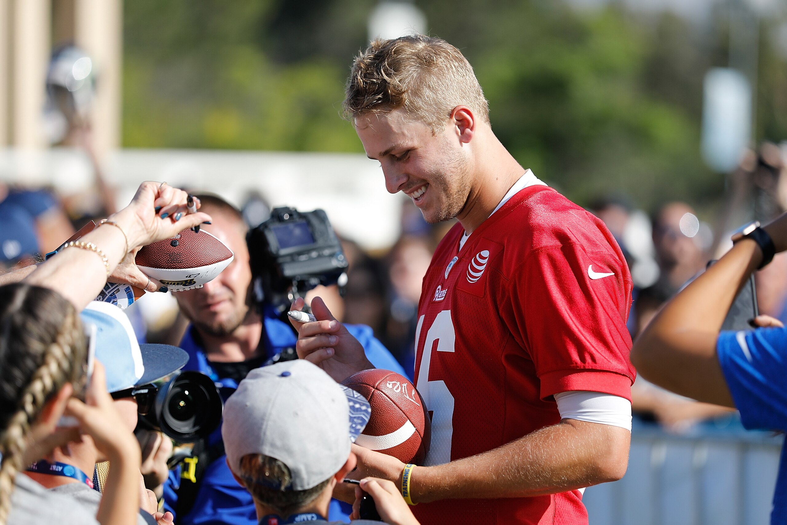 IRVINE, CA - JULY 29: Jared Goff #16 of the Los Angeles Rams signs autographs following the first day of Training Camp at Crawford Field on July 29, 2017 in Irvine, California. (Photo by Josh Lefkowitz/Getty Images) IRVINE, CA - JULY 29: Jared Goff #16 of the Los Angeles Rams signs autographs following the first day of Training Camp at Crawford Field on July 29, 2017 in Irvine, California. (Photo by Josh Lefkowitz/Getty Images)