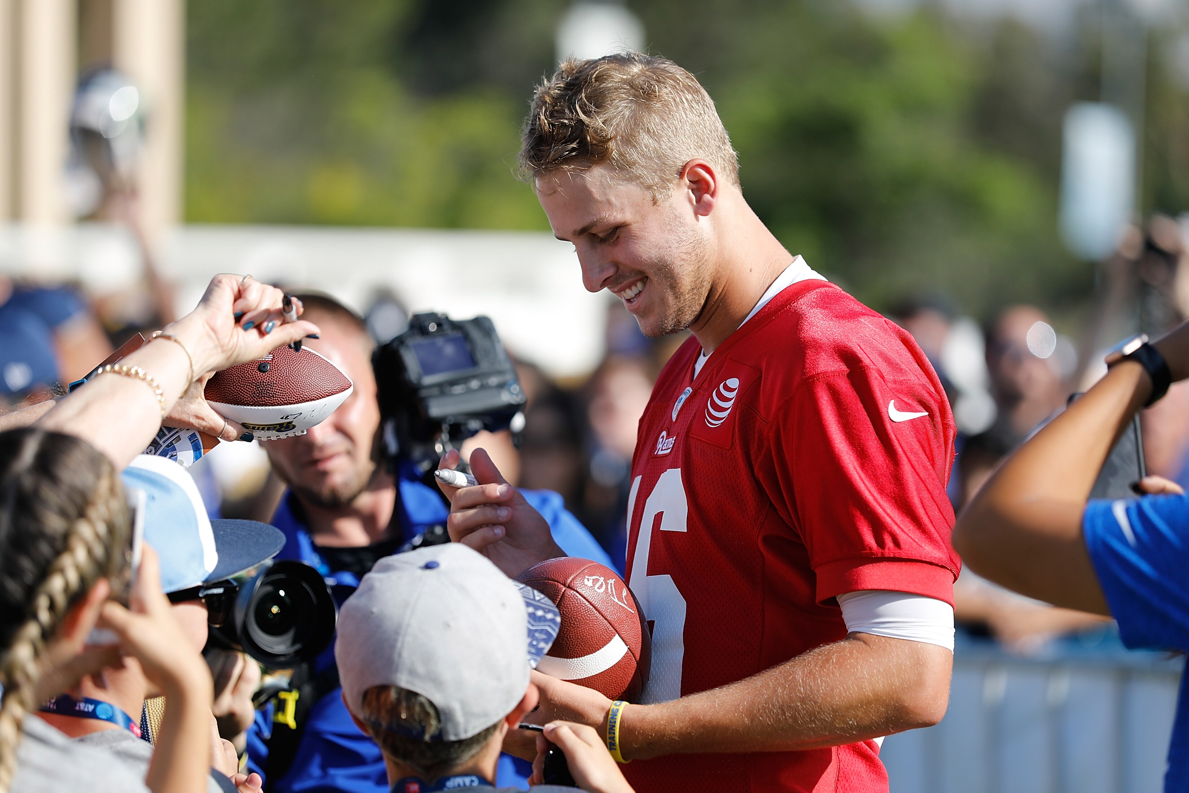 IRVINE, CA - JULY 29: Jared Goff #16 of the Los Angeles Rams signs autographs following the first day of Training Camp at Crawford Field on July 29, 2017 in Irvine, California. (Photo by Josh Lefkowitz/Getty Images) IRVINE, CA - JULY 29: Jared Goff #16 of the Los Angeles Rams signs autographs following the first day of Training Camp at Crawford Field on July 29, 2017 in Irvine, California. (Photo by Josh Lefkowitz/Getty Images)