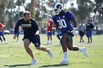 IRVINE, CA - JULY 30:  Head Coach Sean McVay of the Los Angeles Rams runs through a drill with Todd Gurley #30 during Training Camp at Crawford Field on July 30, 2017 in Irvine, California.  (Photo by Josh Lefkowitz/Getty Images)