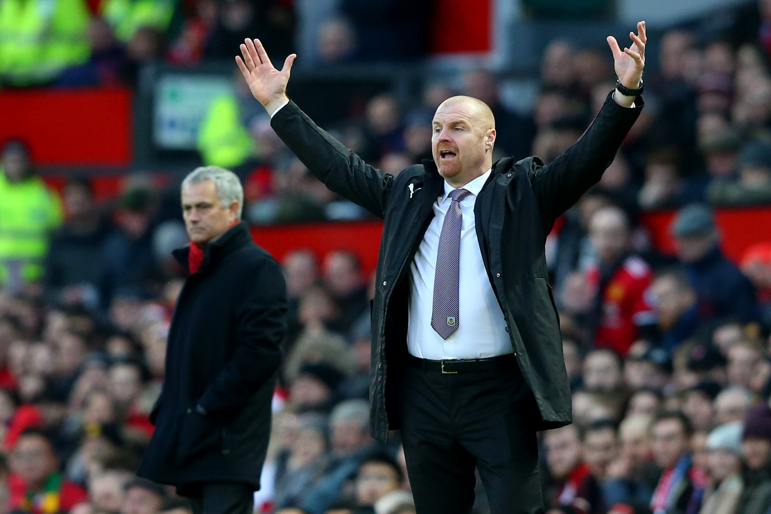 MANCHESTER, ENGLAND - DECEMBER 26:  Sean Dyche, Manager of Burnley makes a point as Jose Mourinho, Manager of Manchester United looks on during the Premier League match between Manchester United and Burnley at Old Trafford on December 26, 2017 in Manchest