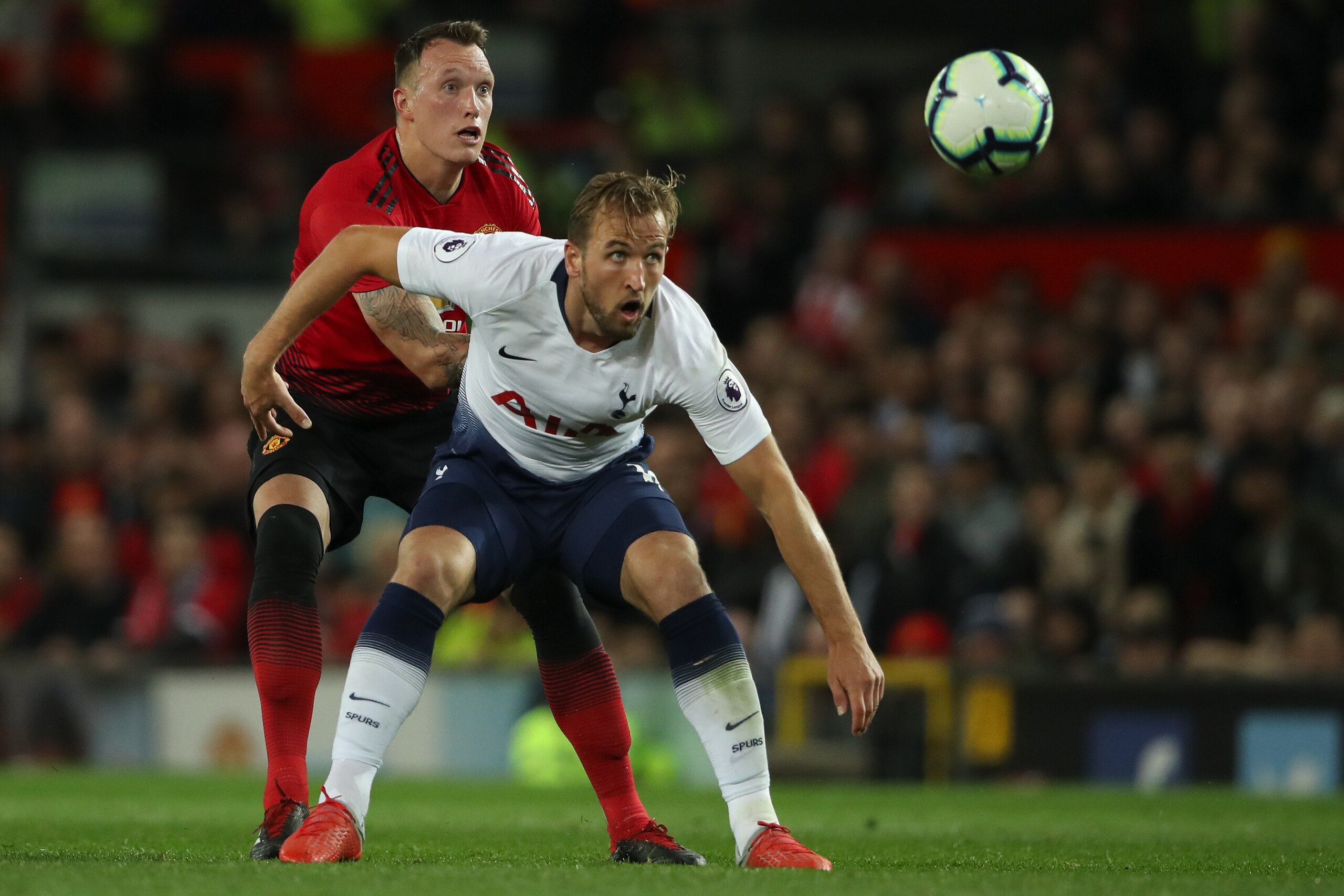 MANCHESTER, ENGLAND - AUGUST 27: Phil Jones of Manchester United and Harry Kane of Tottenham Hotspur during the Premier League match between Manchester United and Tottenham Hotspur at Old Trafford on August 27, 2018 in Manchester, United Kingdom. (Photo b