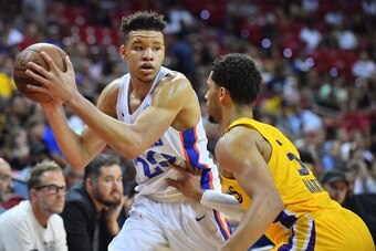 LAS VEGAS, NV - JULY 10:  Kevin Knox #20 of the New York Knicks looks to drive against Josh Hart #5 of the Los Angeles Lakers during the 2018 NBA Summer League at the Thomas & Mack Center on July 10, 2018 in Las Vegas, Nevada. The Lakers defeated the Knic