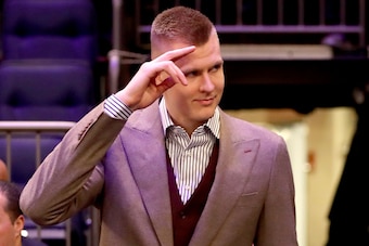 NEW YORK, NY - MARCH 13:  Kristaps Porzingis #6 of the New York Knicks is welcomed back after tearing his ACL previously in the season prior to taking on the Dallas Mavericks during their game at Madison Square Garden on March 13, 2018 in New York City. N