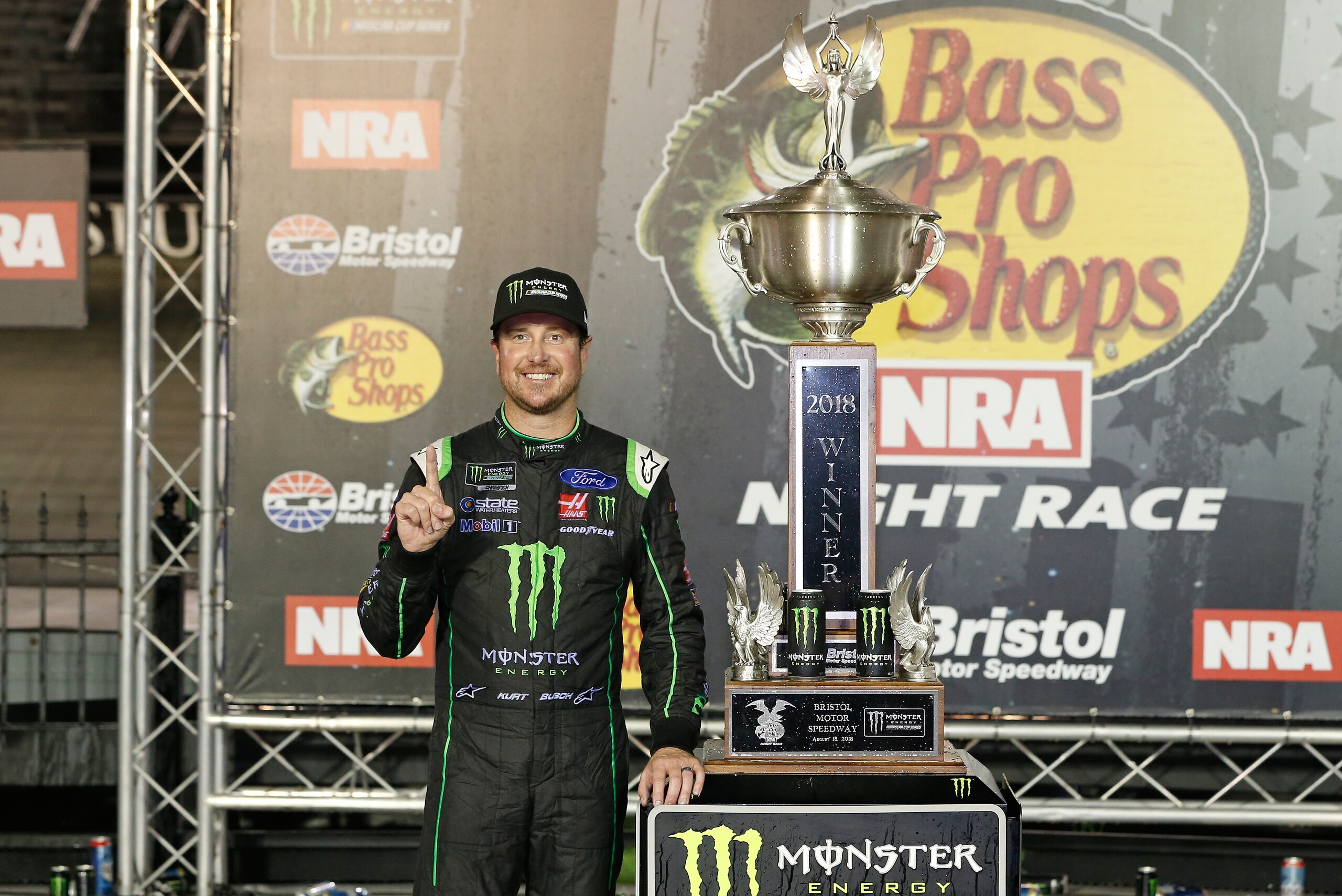 BRISTOL, TN - AUGUST 18:  Kurt Busch, driver of the #41 Monster Energy/Haas Automation Ford, poses with the trophy in Victory Lane after winning the Monster Energy NASCAR Cup Series Bass Pro Shops NRA Night Race at Bristol Motor Speedway on August 18, 201