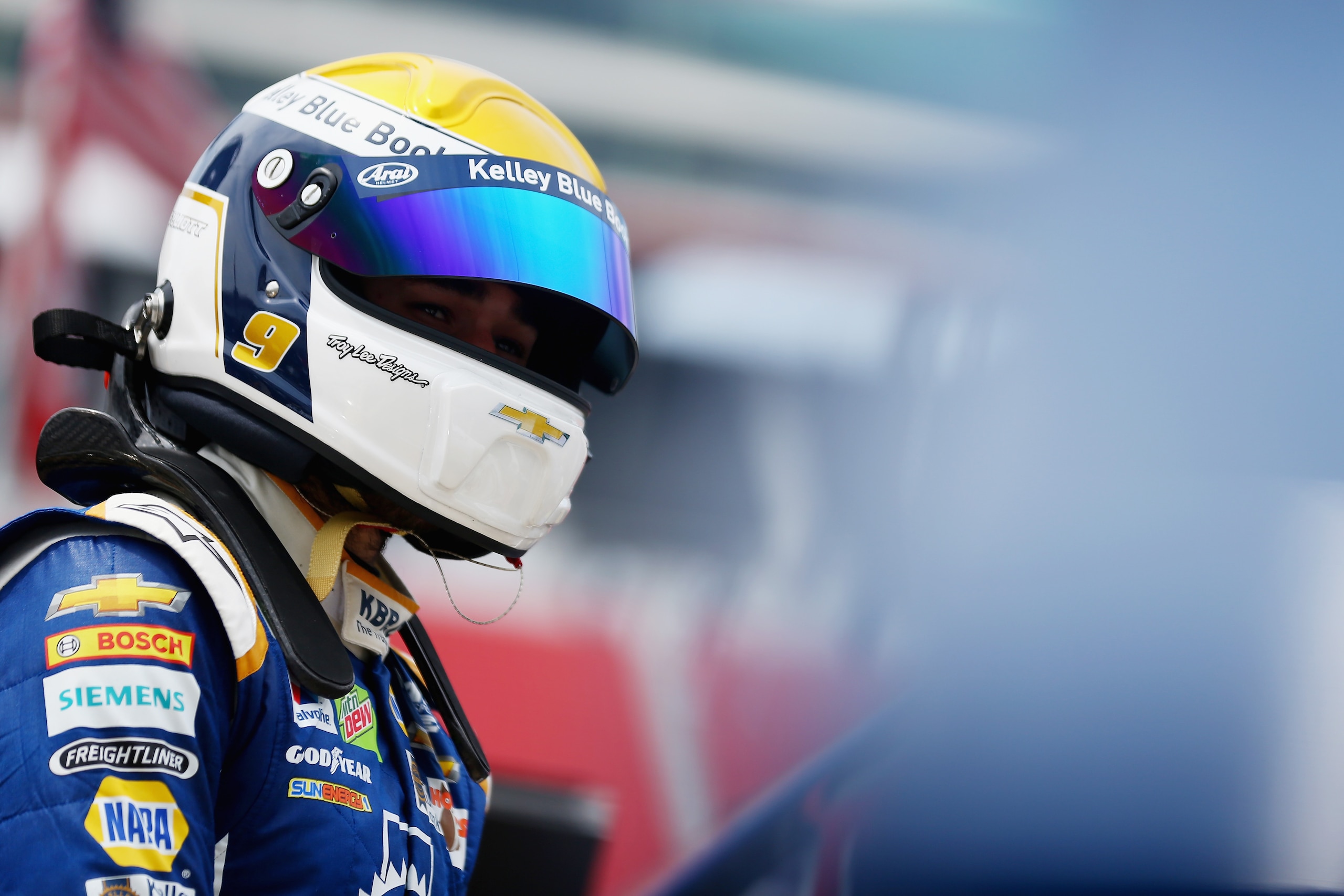 BRISTOL, TN - AUGUST 17:  Chase Elliott, driver of the #9 Kelley Blue Book Chevrolet, stands in the garage area during practice for the Monster Energy NASCAR Cup Series Bass Pro Shops NRA Night Race at Bristol Motor Speedway on August 17, 2018 in Bristol,