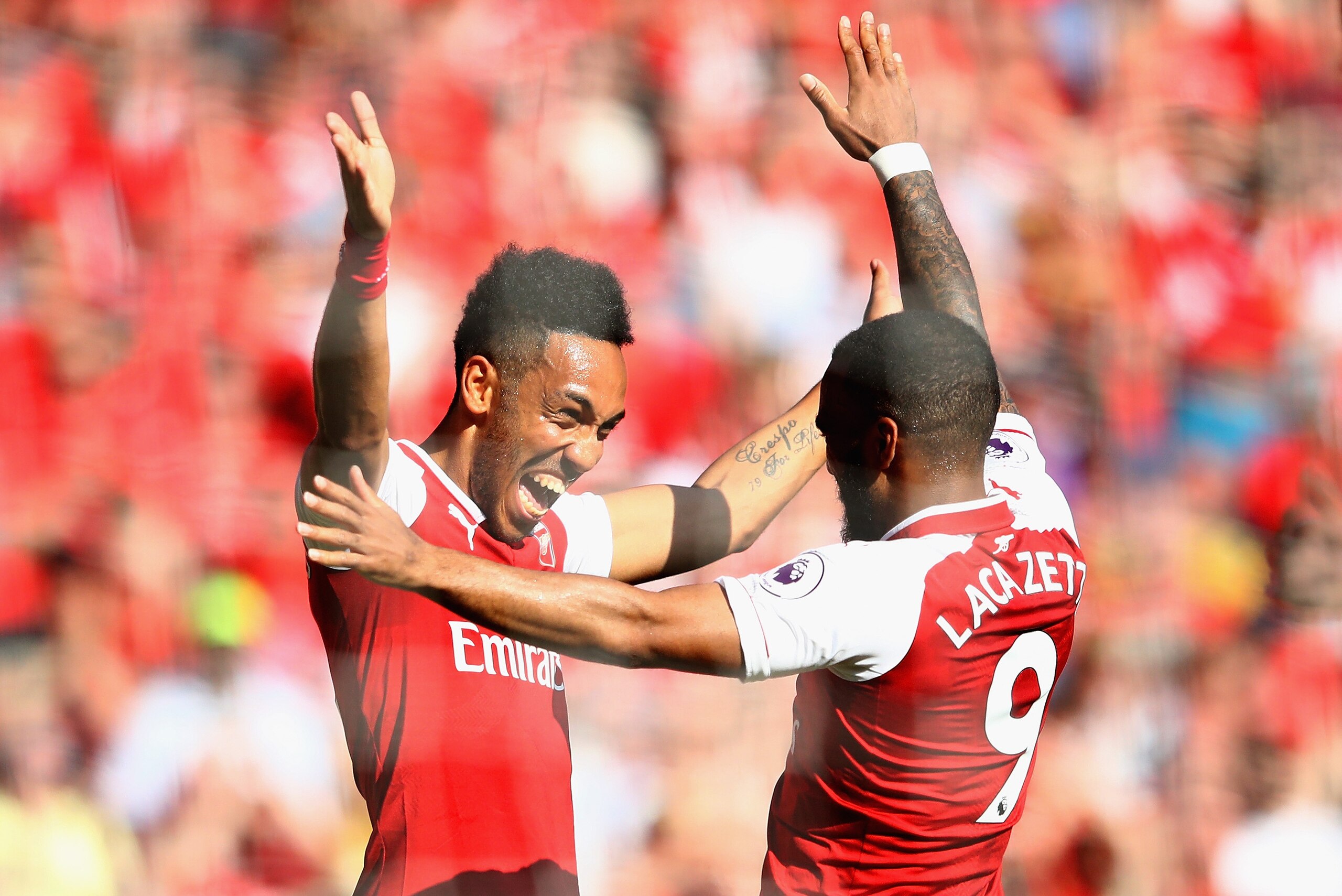 LONDON, ENGLAND - MAY 06: Pierre-Emerick Aubameyang of Arsenal celebrates after scoring his sides first goal with Alexandre Lacazette of Arsenal during the Premier League match between Arsenal and Burnley at Emirates Stadium on May 6, 2018 in London, Eng LONDON, ENGLAND - MAY 06: Pierre-Emerick Aubameyang of Arsenal celebrates after scoring his sides first goal with Alexandre Lacazette of Arsenal during the Premier League match between Arsenal and Burnley at Emirates Stadium on May 6, 2018 in London, Eng