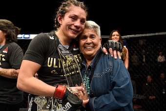LAS VEGAS, NV - DECEMBER 01:  Nicco Montano celebrates with her grandmother after her unanimous-decision victory over Roxanne Modafferi in their women's flyweight championship bout during the TUF Finale event inside Park Theater on December 01, 2017 in La