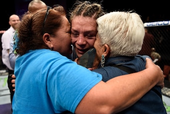 LAS VEGAS, NV - DECEMBER 01:  Nicco Montano celebrates with her mother and grandmother her unanimous-decision victory over Roxanne Modafferi in their women's flyweight championship bout during the TUF Finale event inside Park Theater on December 01, 2017 
