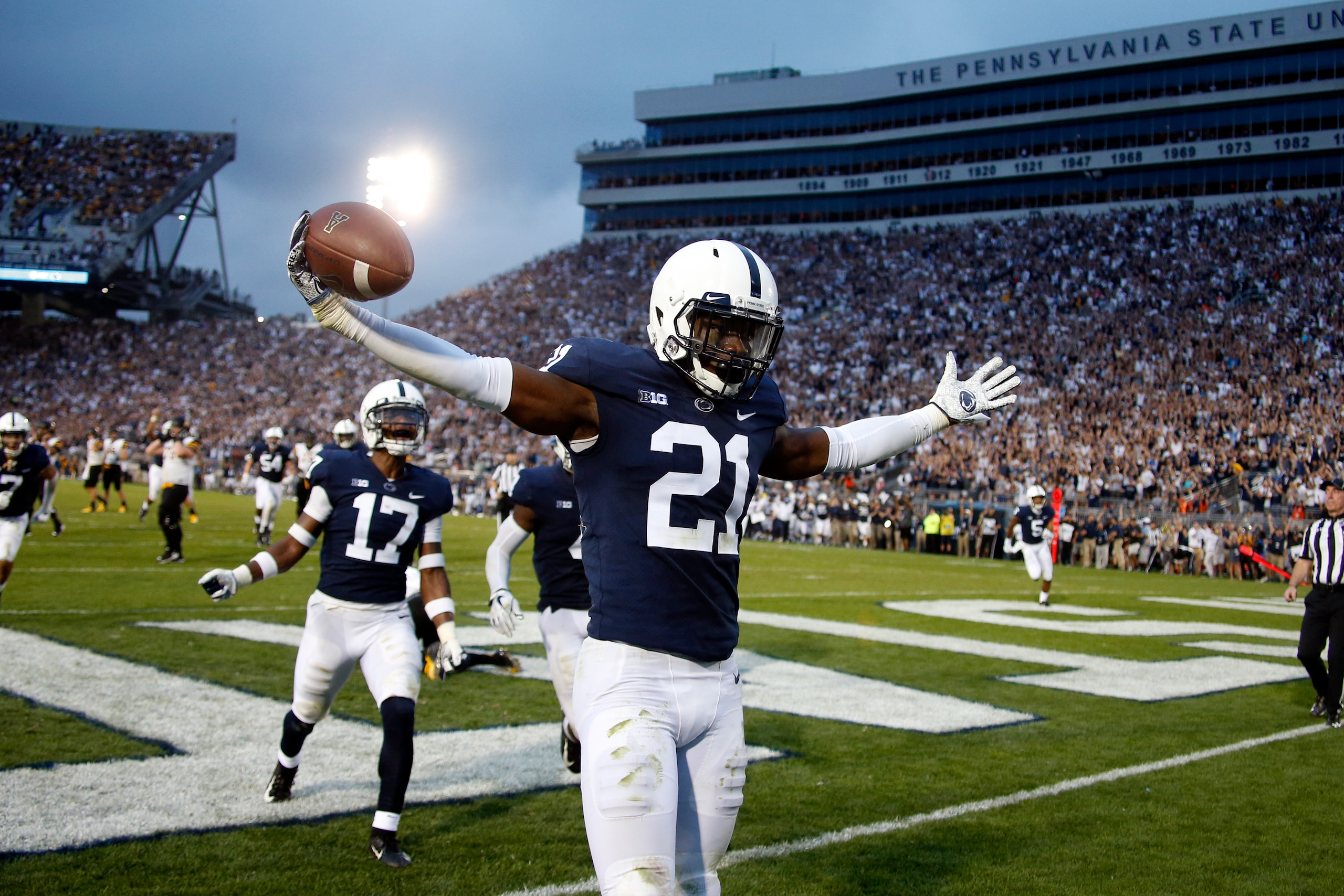 STATE COLLEGE, PA - SEPTEMBER 01:  Amani Oruwariye #21 of the Penn State Nittany Lions celebrates after intercepting a pass in overtime to clinch the win against the Appalachian State Mountaineers on September 1, 2018 at Beaver Stadium in State College, P