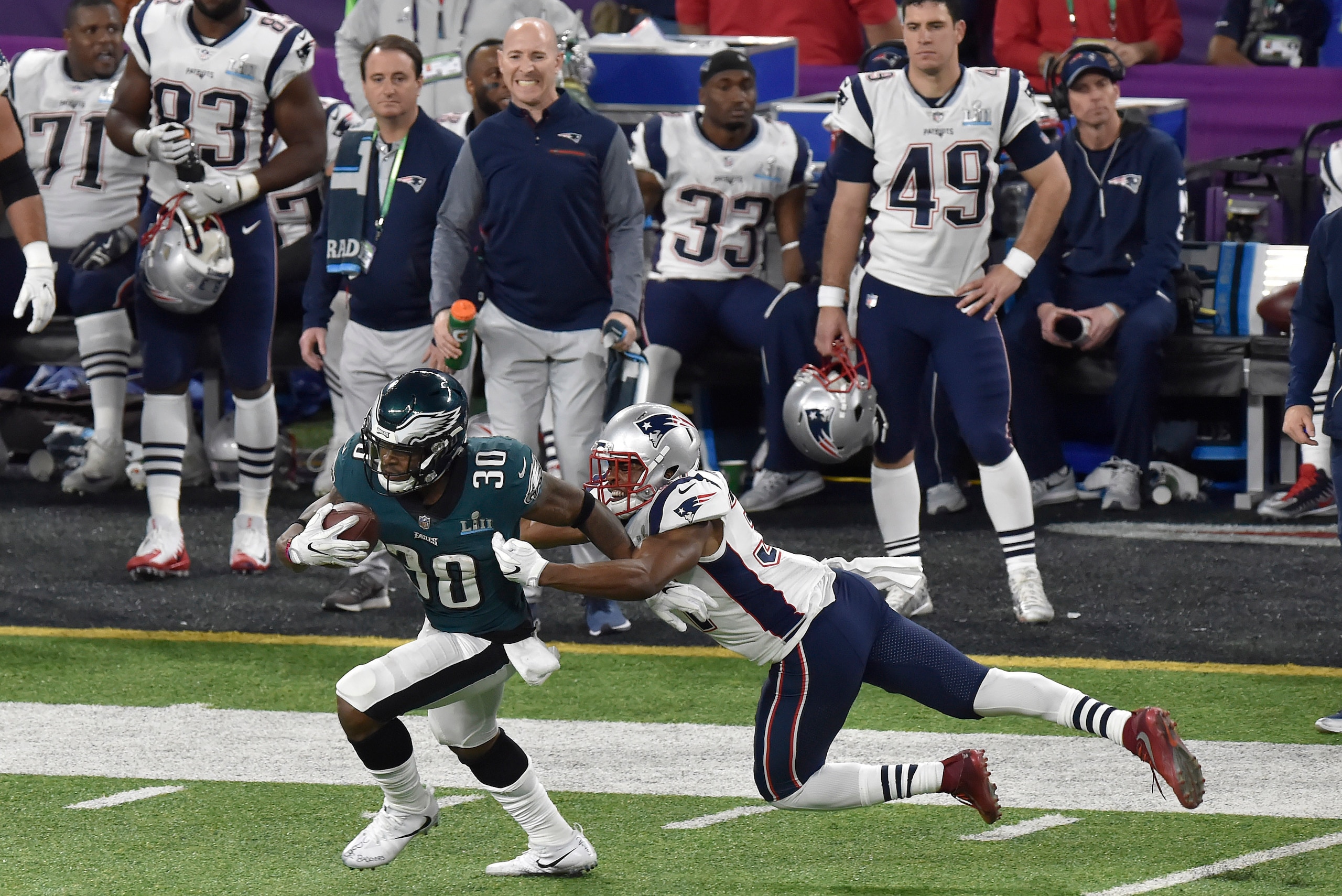 MINNEAPOLIS, MN - FEBRUARY 04: Corey Clement #30 of the Philadelphia Eagles running with the ball breaks the tackle of Jordan Richards #37 of the New England Patriots during Super Bowl LII at U.S. Bank Stadium on February 4, 2018 in Minneapolis, Minnesot MINNEAPOLIS, MN - FEBRUARY 04: Corey Clement #30 of the Philadelphia Eagles running with the ball breaks the tackle of Jordan Richards #37 of the New England Patriots during Super Bowl LII at U.S. Bank Stadium on February 4, 2018 in Minneapolis, Minnesot