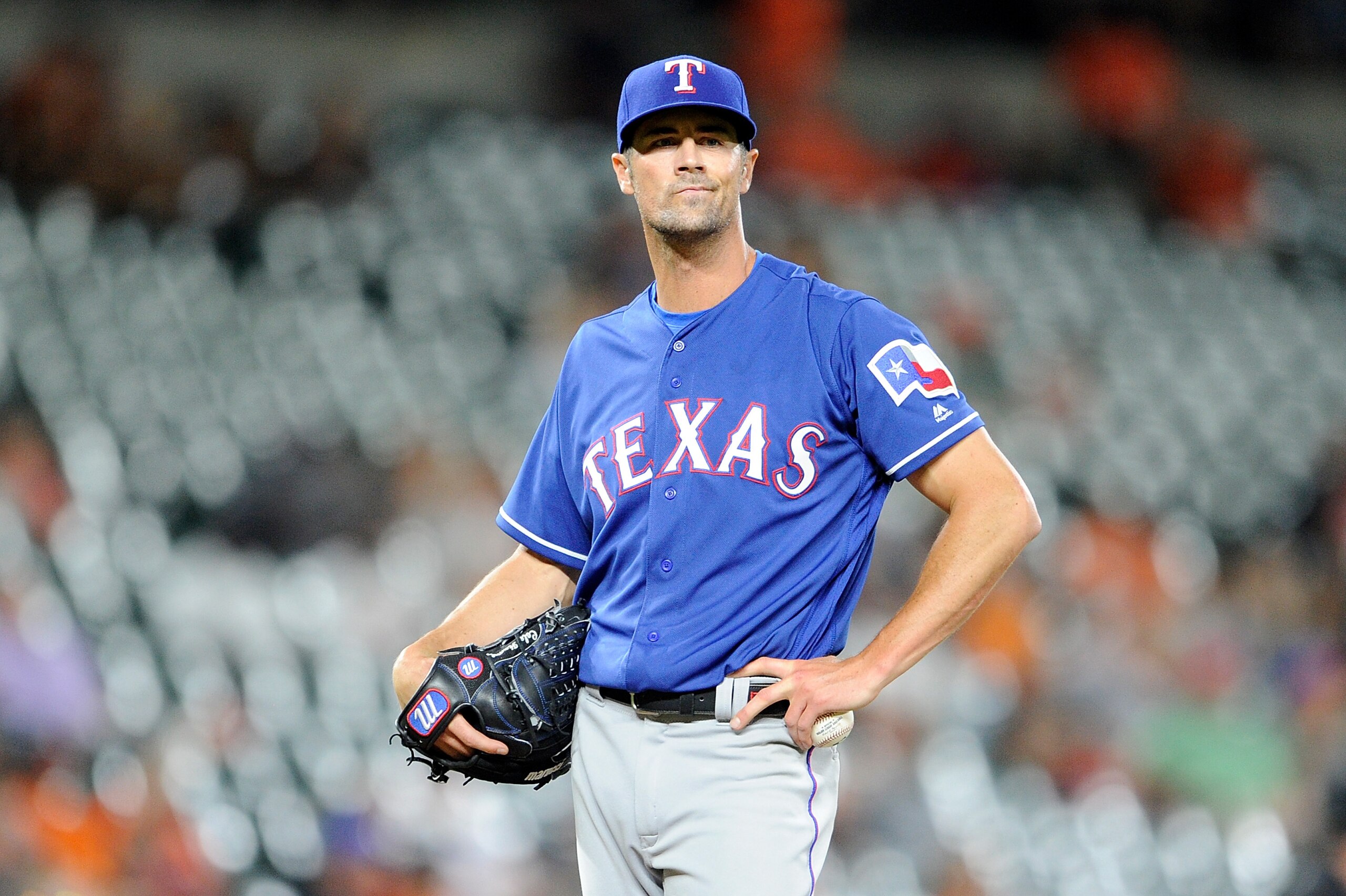 BALTIMORE, MD - JULY 13:  Cole Hamels #35 of the Texas Rangers pitches against the Baltimore Orioles at Oriole Park at Camden Yards on July 13, 2018 in Baltimore, Maryland.  (Photo by G Fiume/Getty Images)