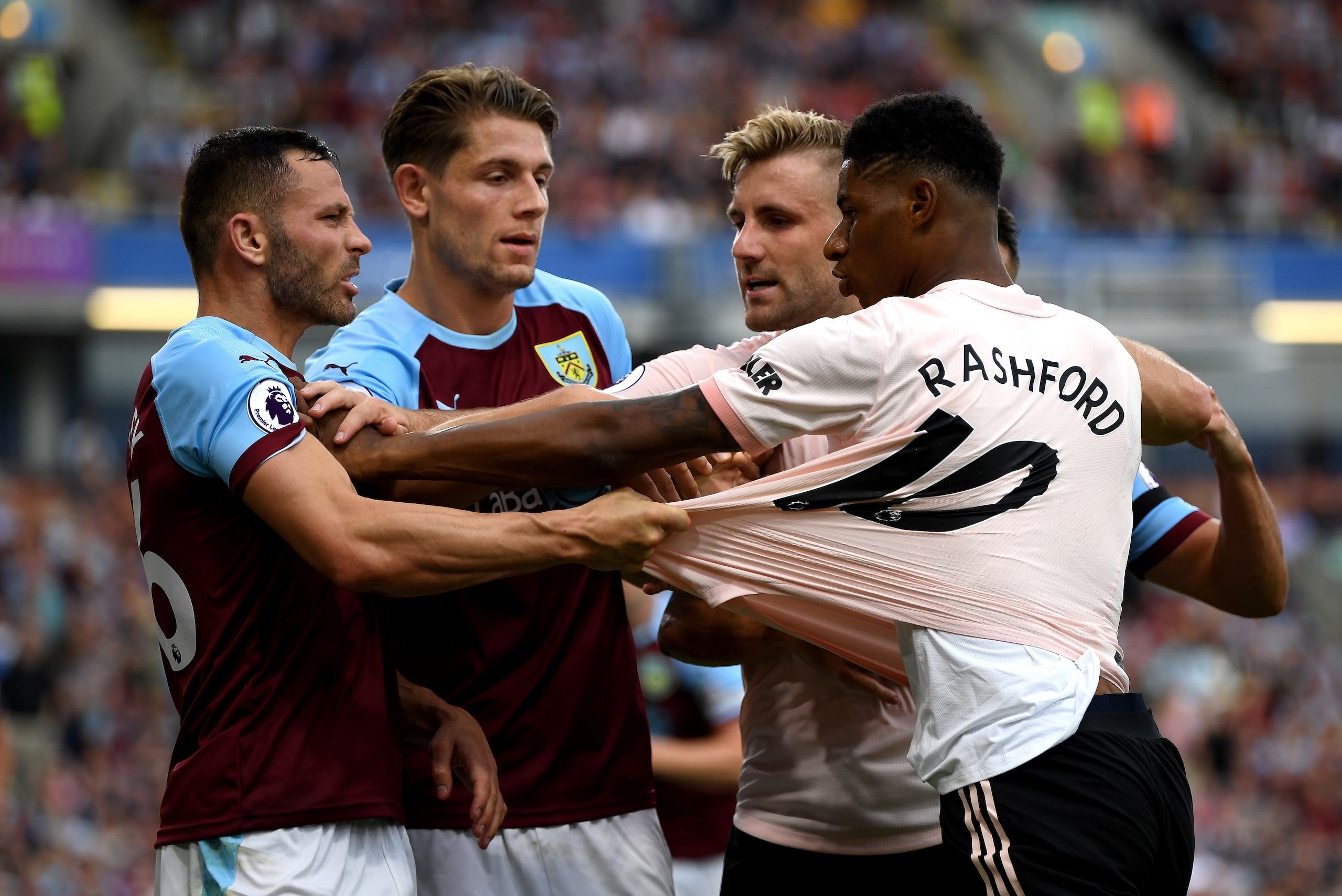 BURNLEY, ENGLAND - SEPTEMBER 02:  Marcus Rashford of Manchester United and Phil Bardsley of Burnley clash leading to a red card for Rashford during the Premier League match between Burnley FC and Manchester United at Turf Moor on September 2, 2018 in Burn