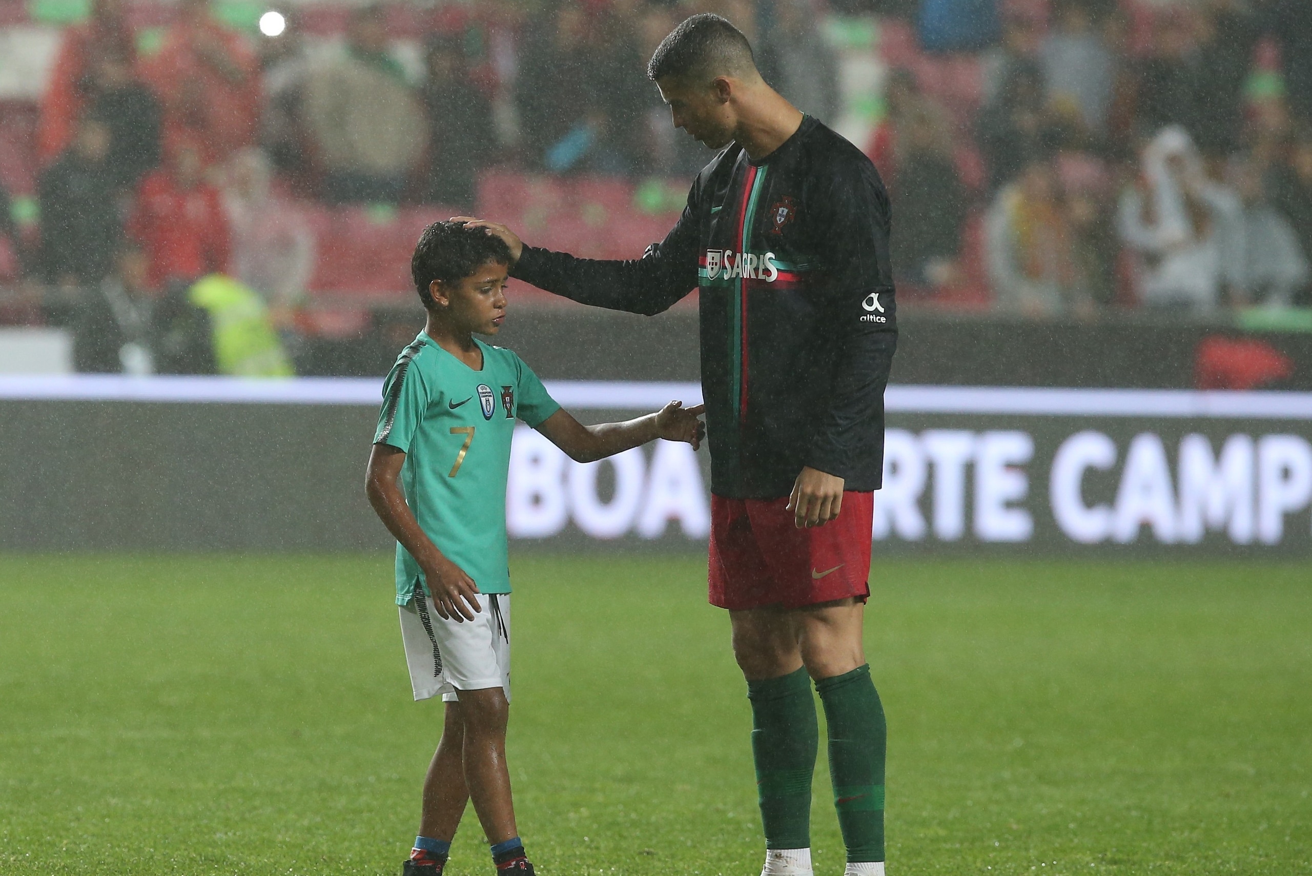 LISBON, PORTUGAL - JUNE 7:  Portugal and Real Madrid forward Cristiano Ronaldo son Cristianinho plays with is father at the end of the International Friendly match between Portugal and Algeria at Estadio da Luz on June 7, 2018 in Lisbon, Portugal.  (Photo