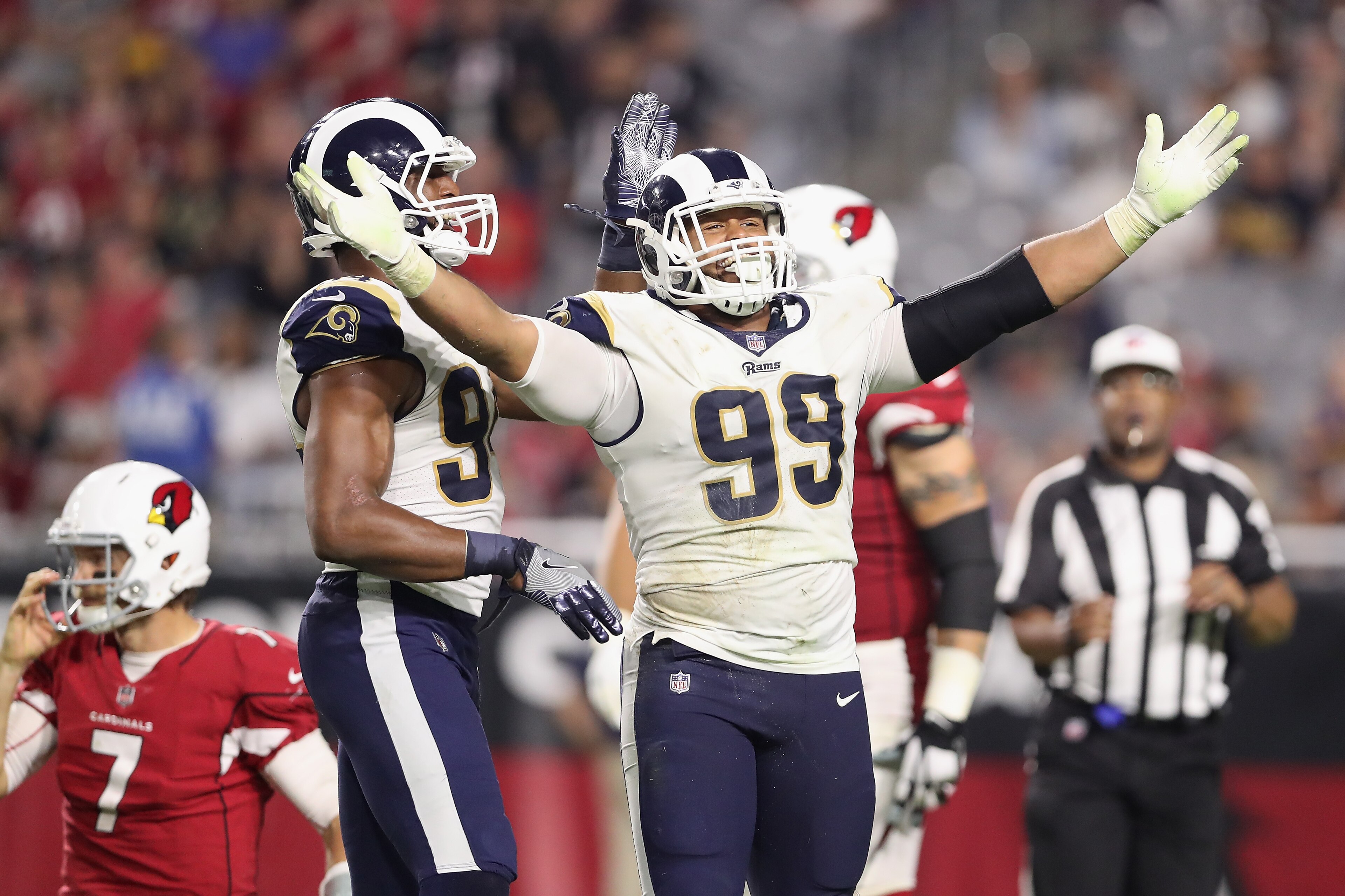 GLENDALE, AZ - DECEMBER 03: Defensive end Aaron Donald #99 of the Los Angeles Rams reacts after a tackle on quarterback Blaine Gabbert #7 of the Arizona Cardinals during the second half of the NFL game at the University of Phoenix Stadium on December 3, GLENDALE, AZ - DECEMBER 03: Defensive end Aaron Donald #99 of the Los Angeles Rams reacts after a tackle on quarterback Blaine Gabbert #7 of the Arizona Cardinals during the second half of the NFL game at the University of Phoenix Stadium on December 3,