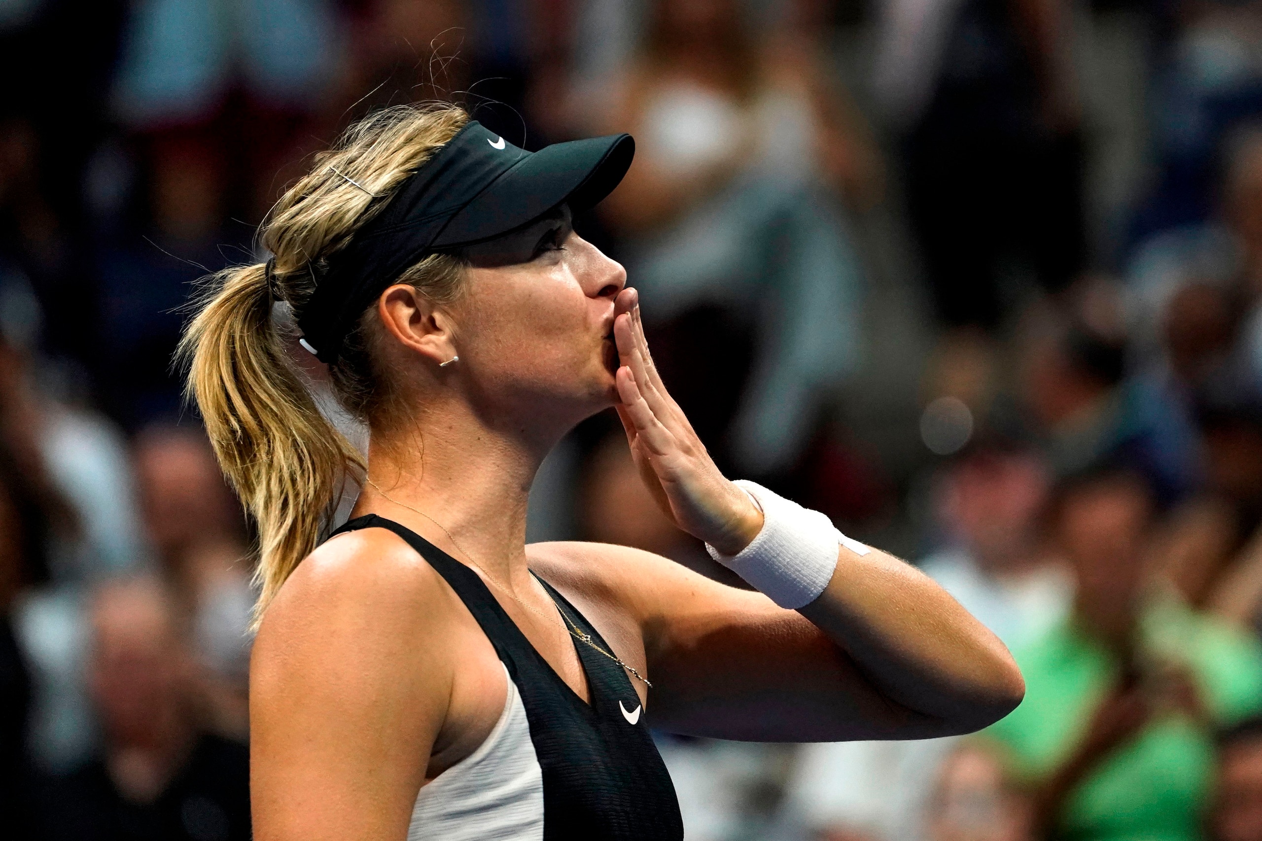 Russia's Maria Sharapova celebrates after defeating Latvia's Jelena Ostapenko during their 2018 US Open Women's Singles tennis match at the USTA Billie Jean King National Tennis Center in New York on September 1, 2018. (Photo by EDUARDO MUNOZ ALVAREZ / AF