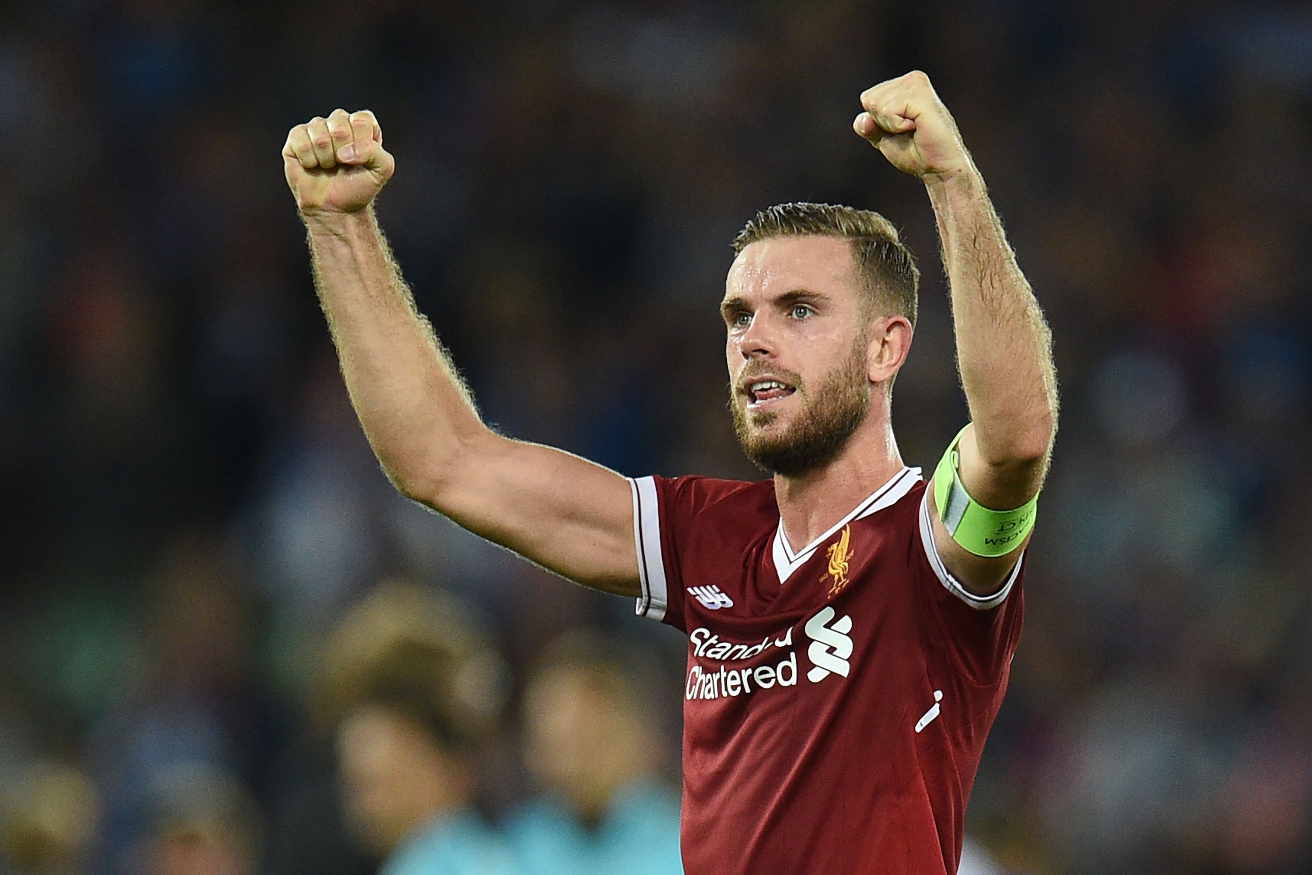 Liverpool's English captain Jordan Henderson celebrates victory after the Champions League qualifier, second leg match between Liverpool and Hoffenheim at Anfield stadium in Liverpool on August 23, 2017. / AFP PHOTO / Oli SCARFF (Photo credit shoul Liverpool's English captain Jordan Henderson celebrates victory after the Champions League qualifier, second leg match between Liverpool and Hoffenheim at Anfield stadium in Liverpool on August 23, 2017. / AFP PHOTO / Oli SCARFF (Photo credit shoul